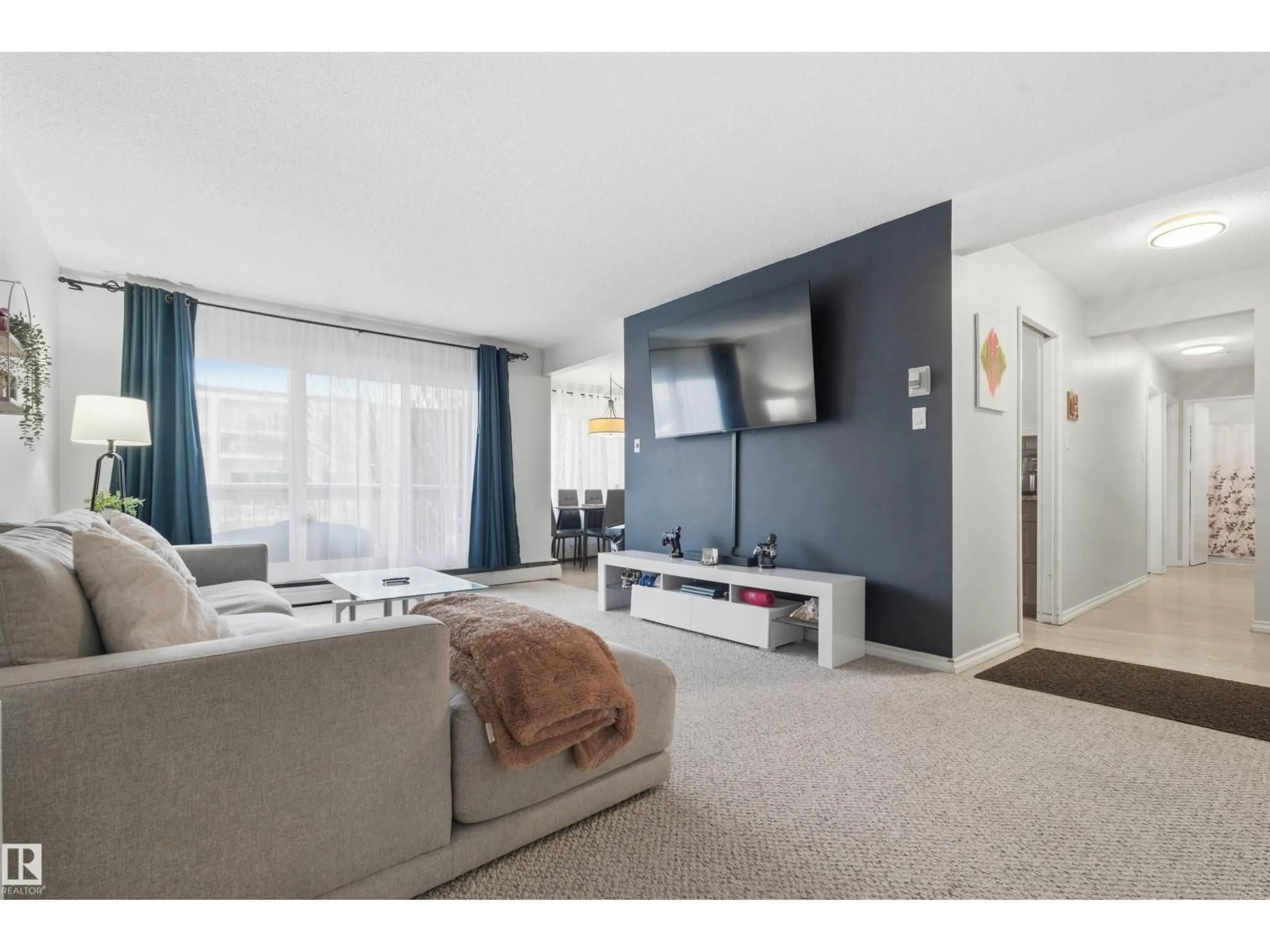 Living room with furniture, unknown for 205 - 11440 40 AVENUE NW, Edmonton Alberta T6J0R5
