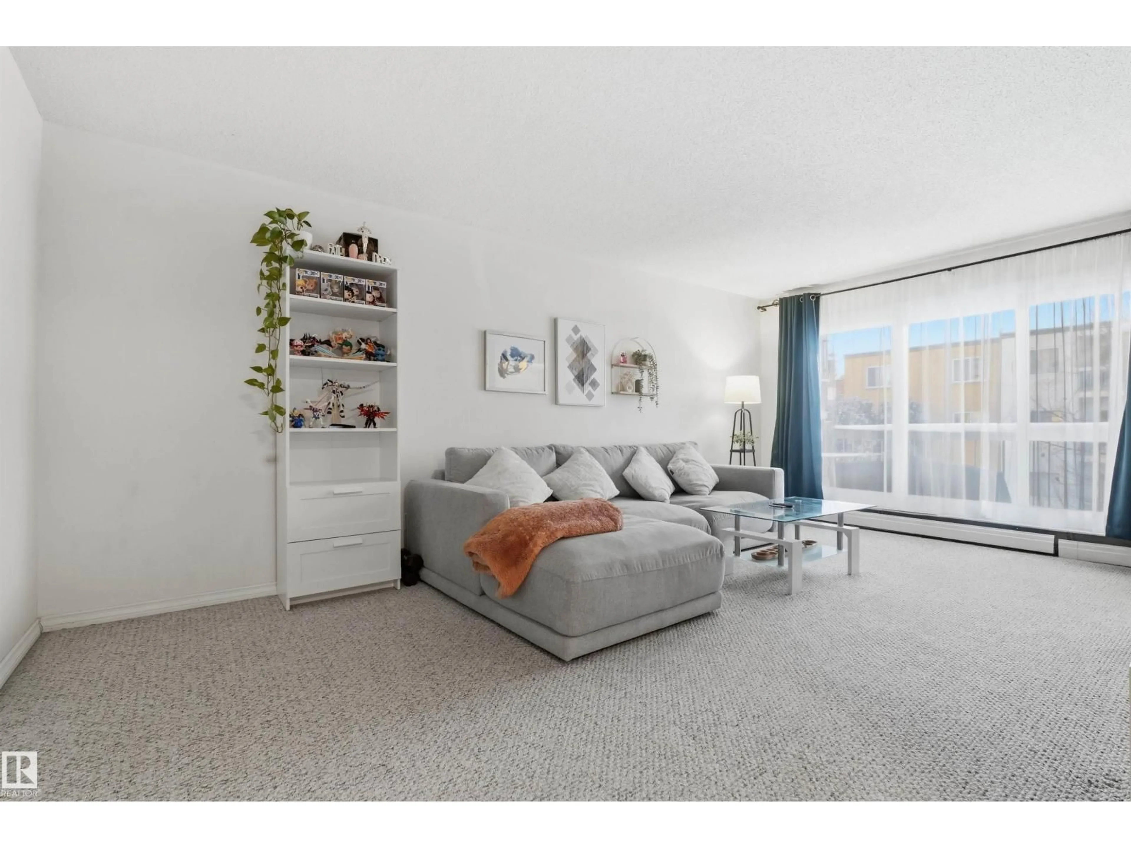 Living room with furniture, unknown for 205 - 11440 40 AVENUE NW, Edmonton Alberta T6J0R5