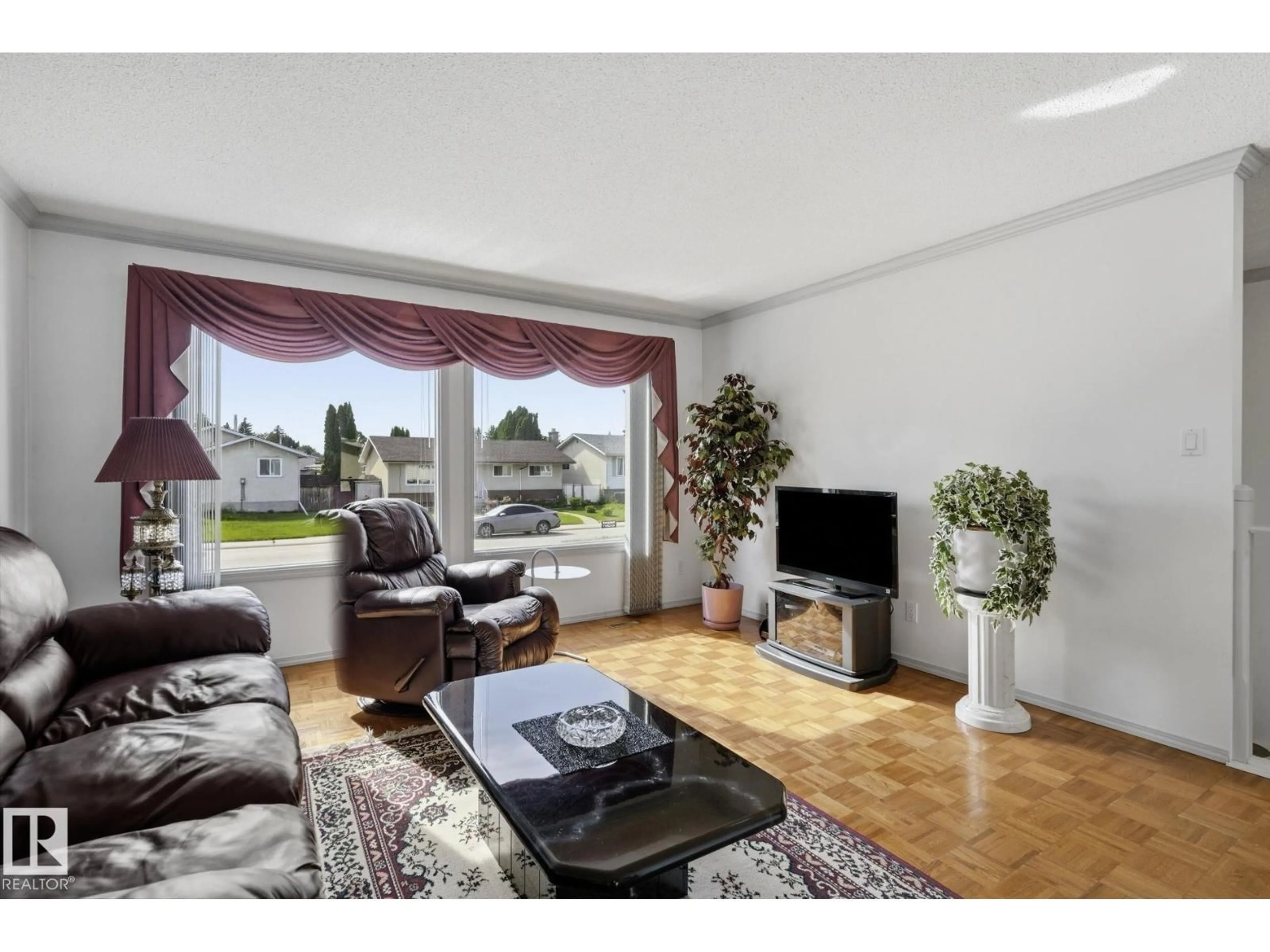 Living room with furniture, wood/laminate floor for NW - 14511 83 ST, Edmonton Alberta T5E2Y1
