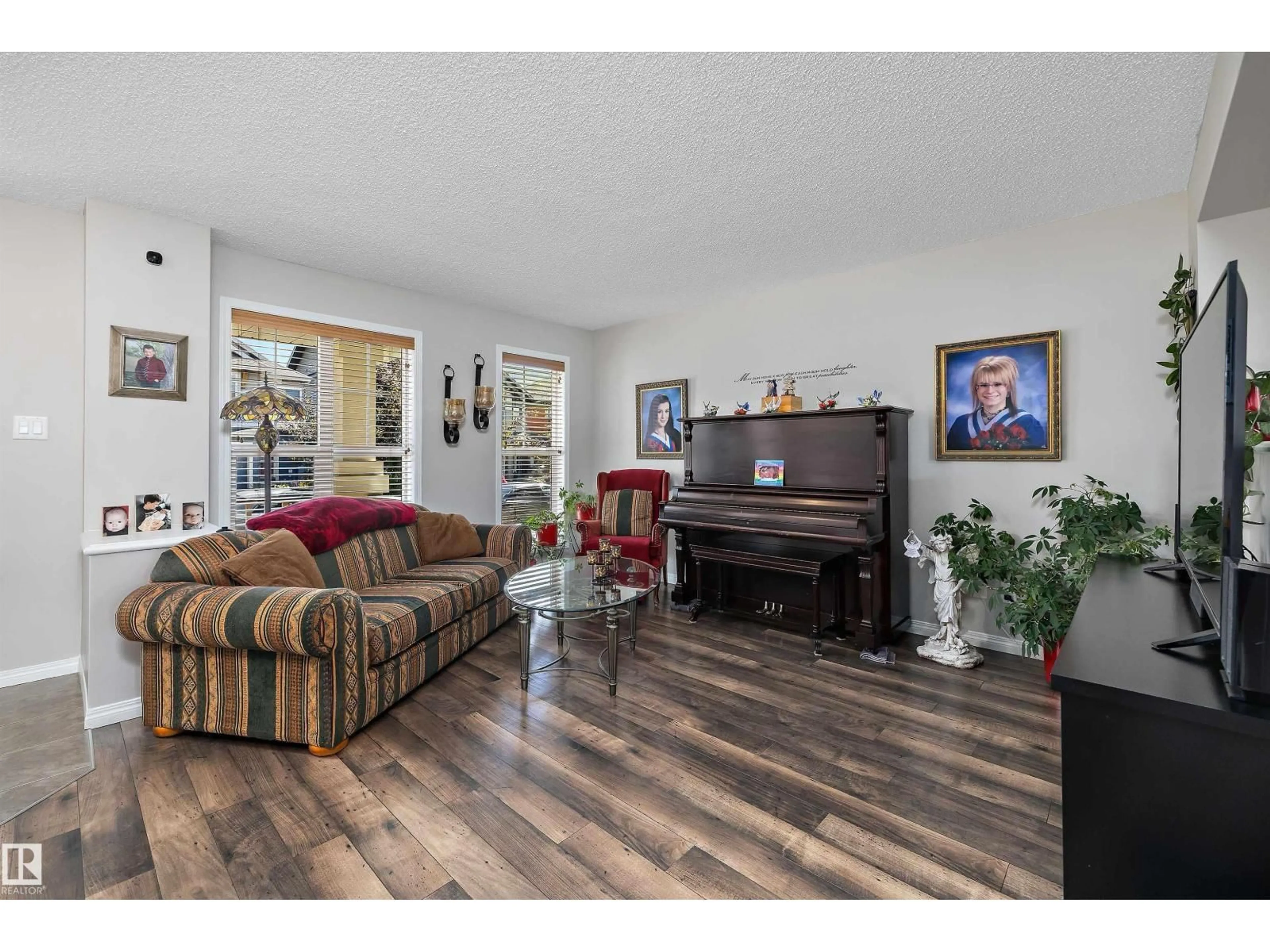Living room with furniture, wood/laminate floor for SW SW - 4688 CRABAPPLE RU, Edmonton Alberta T6X0Y8