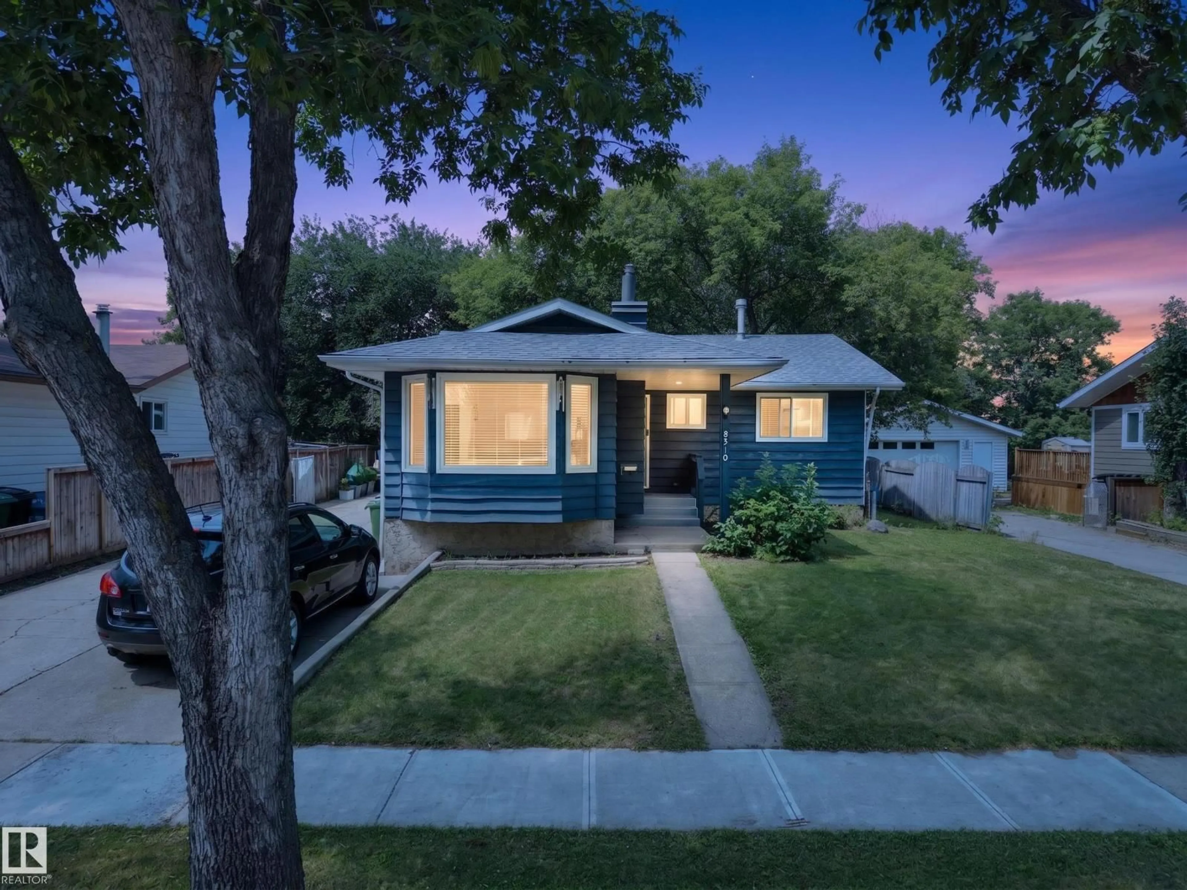 Home with vinyl exterior material, street for 8310 99 AV, Fort Saskatchewan Alberta T8L3C5