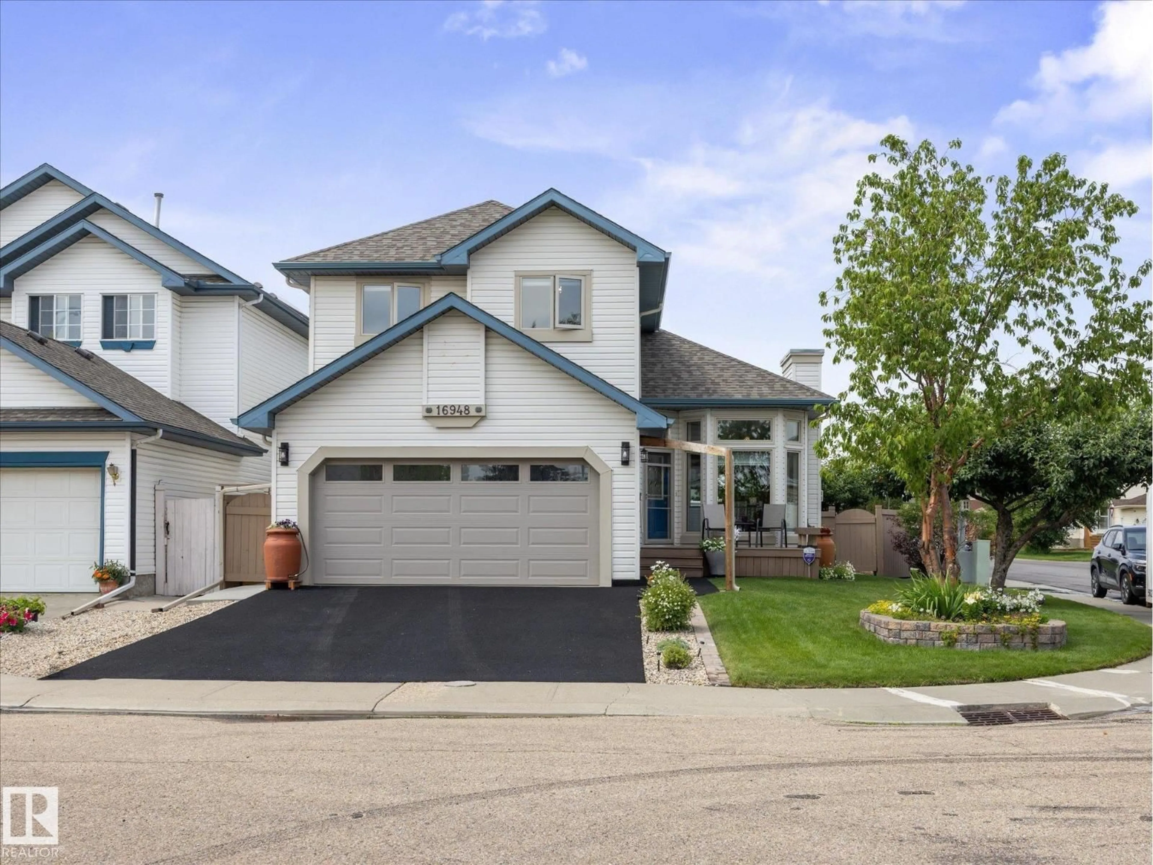 Home with vinyl exterior material, street for 16948 116 ST, Edmonton Alberta T5X3T8