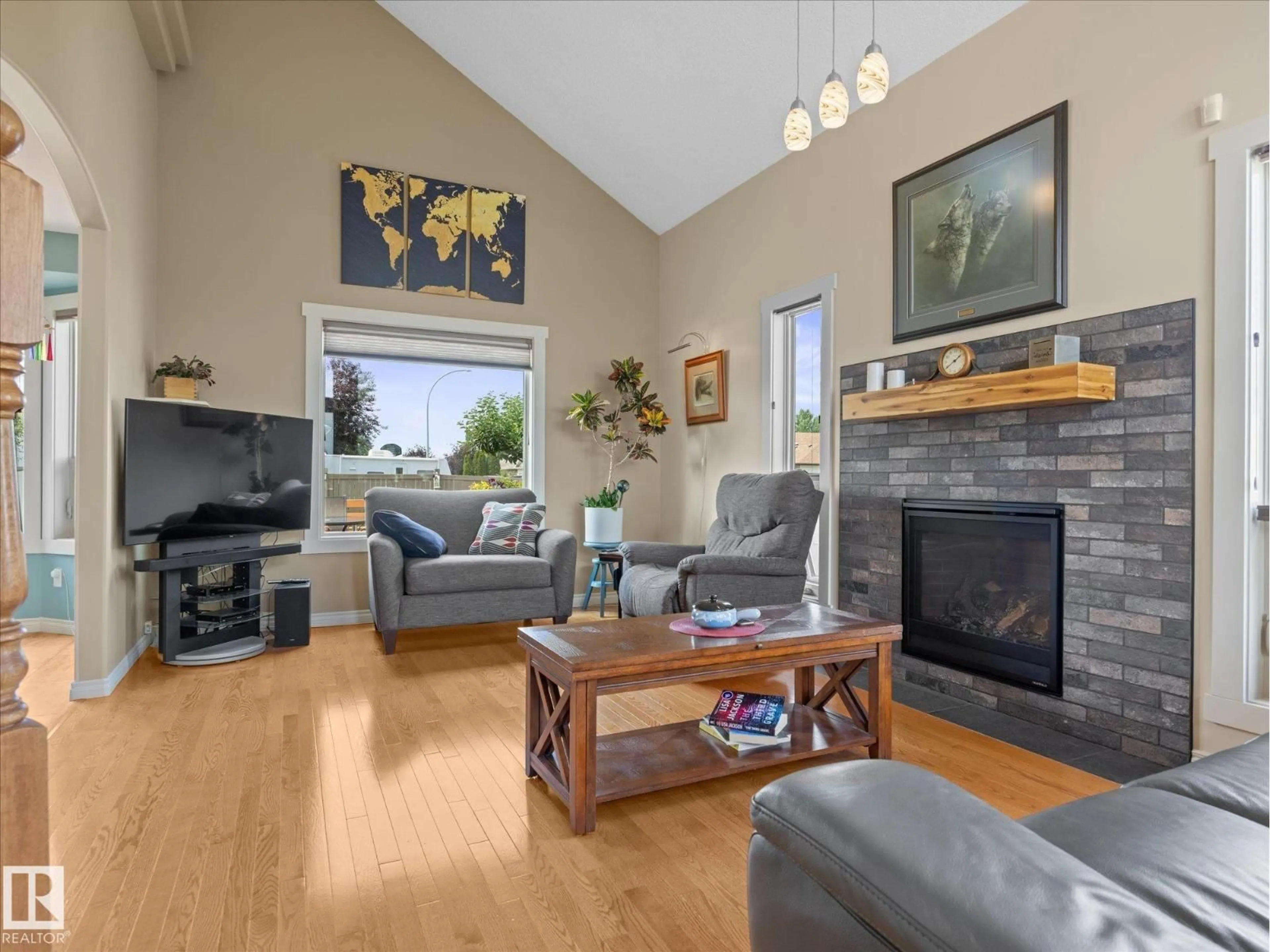 Living room with furniture, wood/laminate floor for 16948 116 ST, Edmonton Alberta T5X3T8
