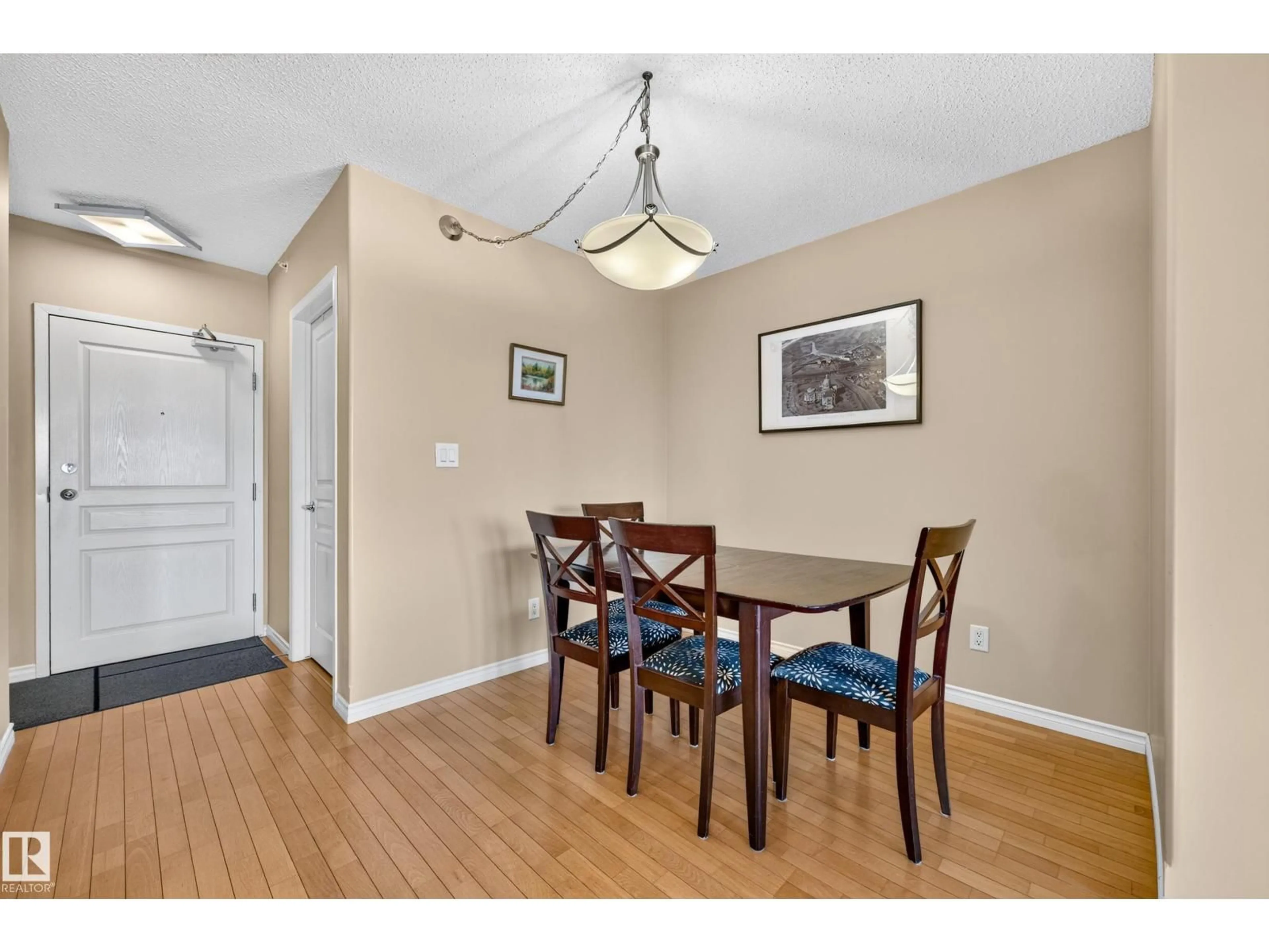 Dining room, wood/laminate floor for 703 - 9707 106 ST NW, Edmonton Alberta T5K0B7