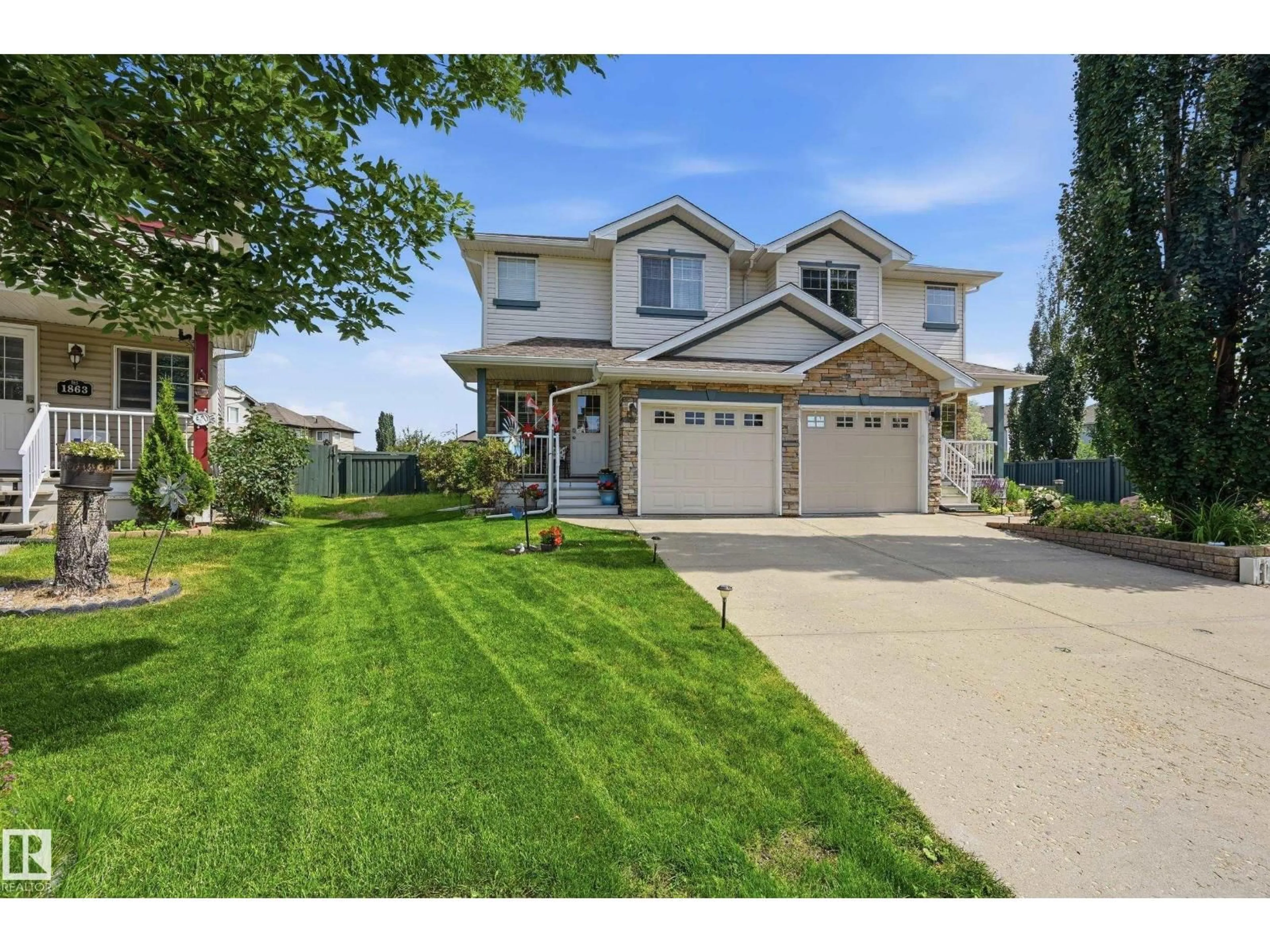 Home with vinyl exterior material, street for SW - 1867 119 ST, Edmonton Alberta T6W1W4