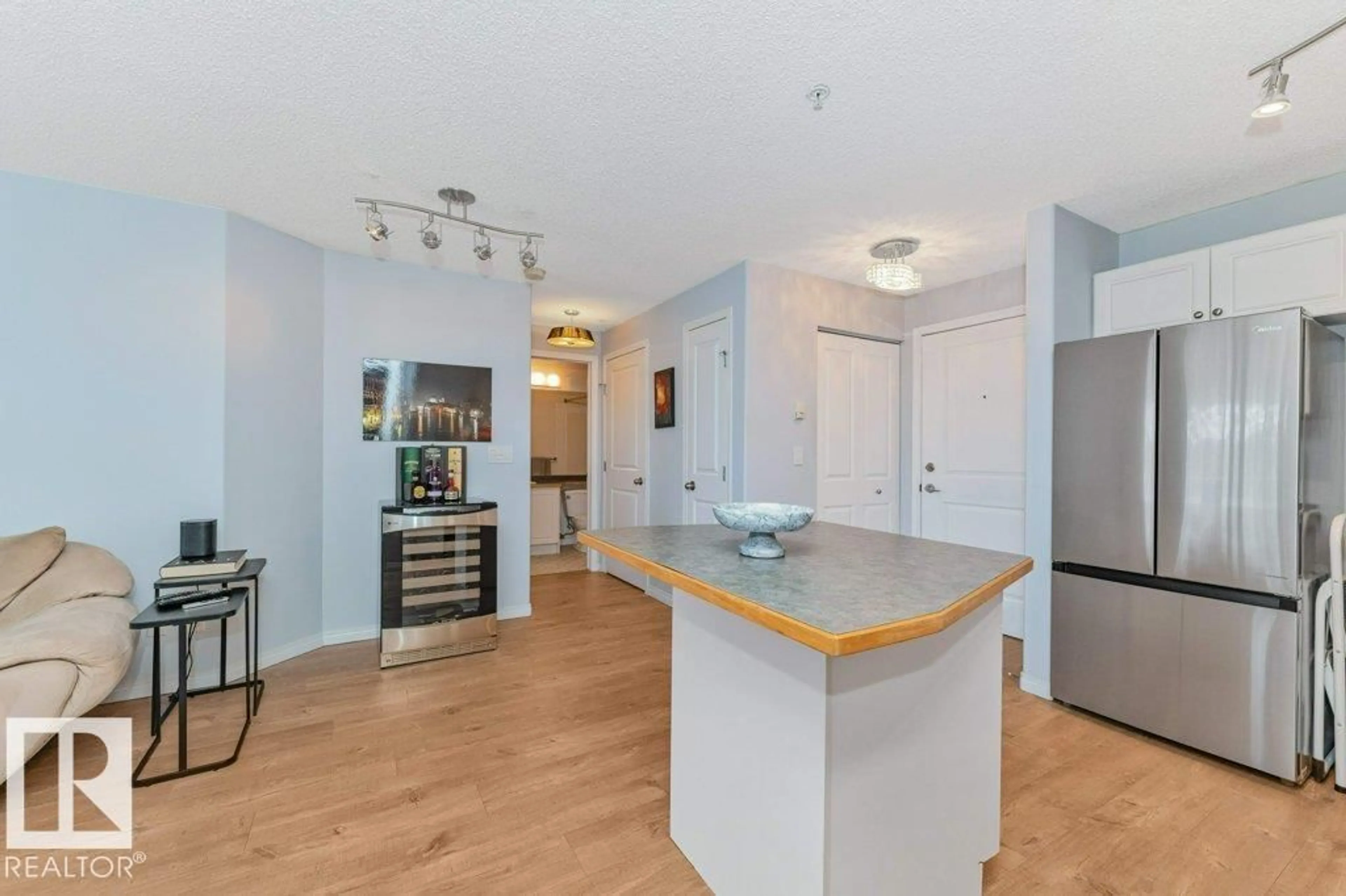 Open concept kitchen, wood/laminate floor for 217 - 245 EDWARDS DR, Edmonton Alberta T6X1J9