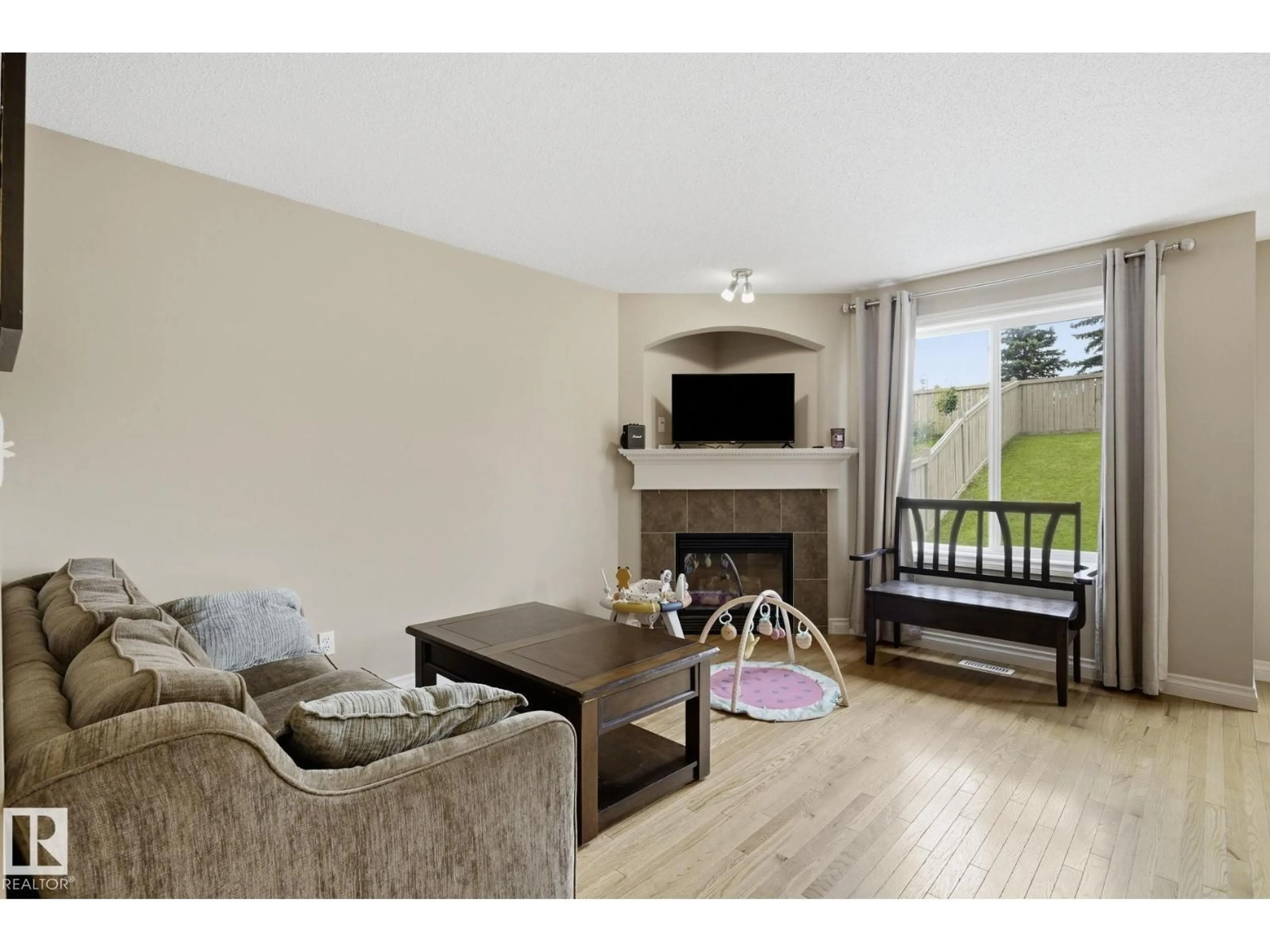 Living room with furniture, wood/laminate floor for 91 HARTWICK LO, Spruce Grove Alberta T7X0A5