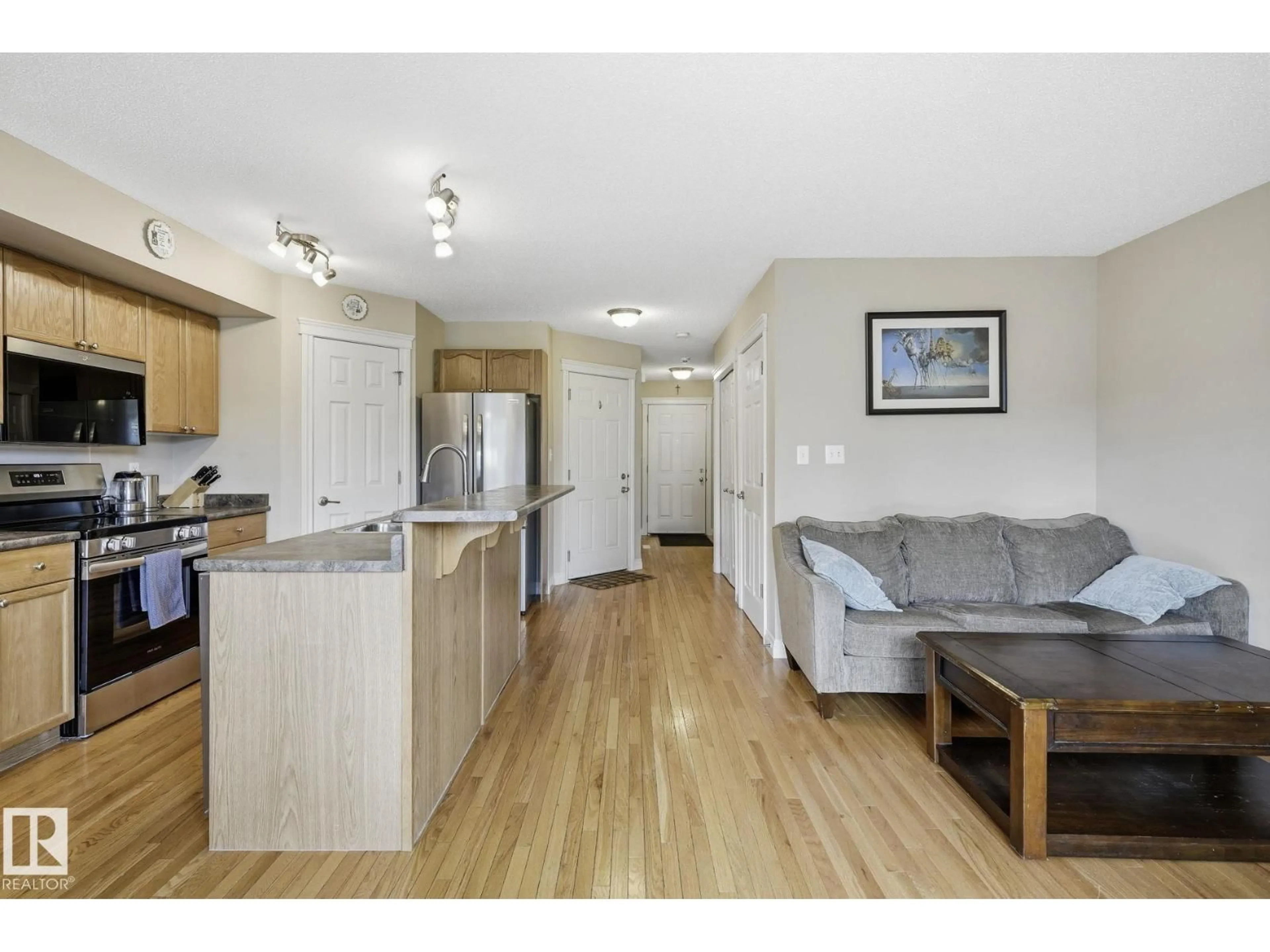 Open concept kitchen, wood/laminate floor for 91 HARTWICK LO, Spruce Grove Alberta T7X0A5