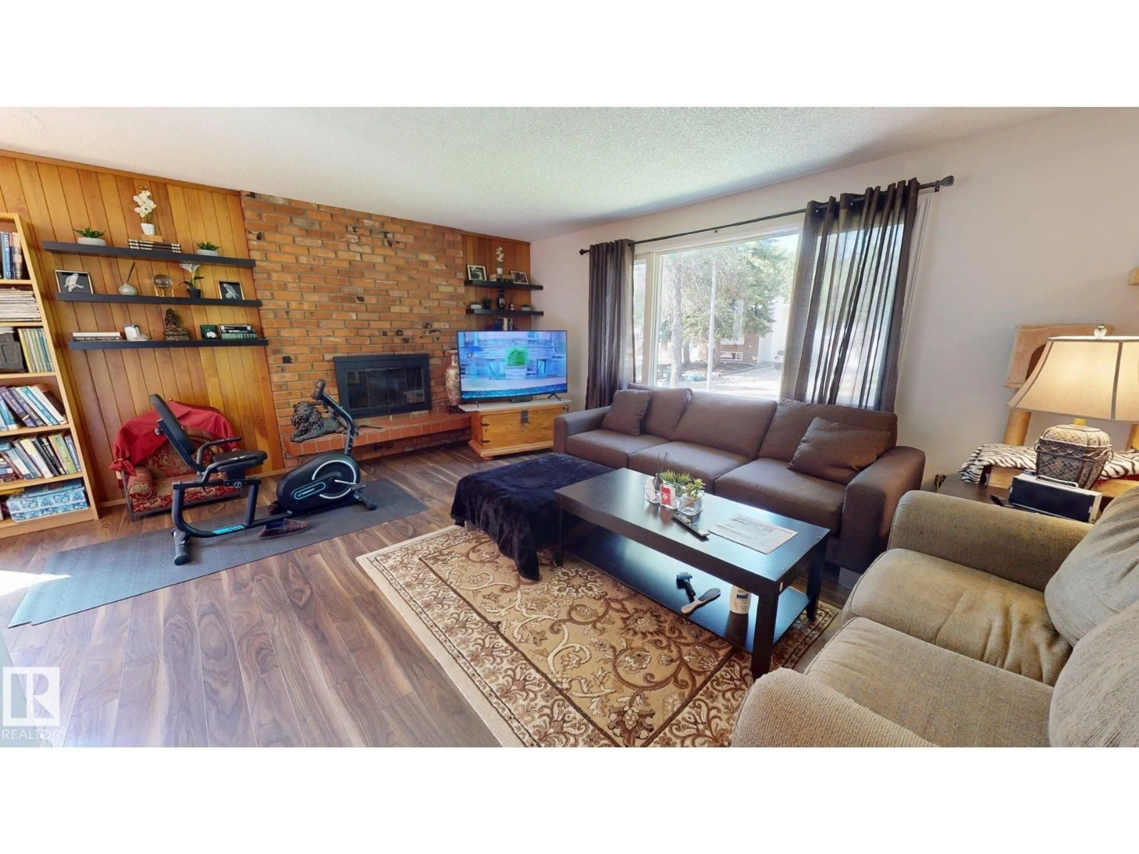 Living room with furniture, wood/laminate floor for 5 MARCHAND PL, St. Albert Alberta T8N1L7