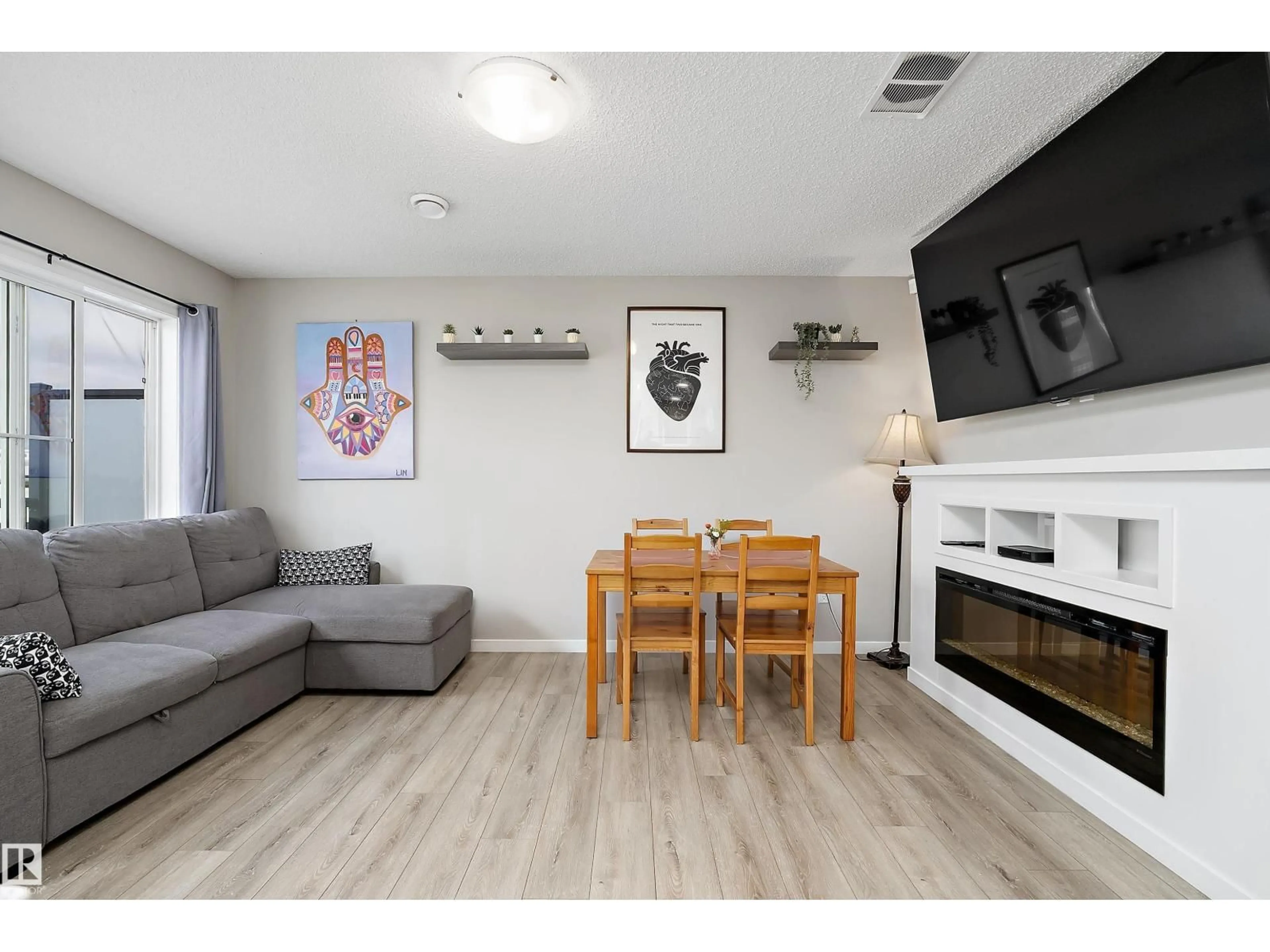 Living room with furniture, wood/laminate floor for 65 MCLAUGHLIN DR, Spruce Grove Alberta T7X0E1