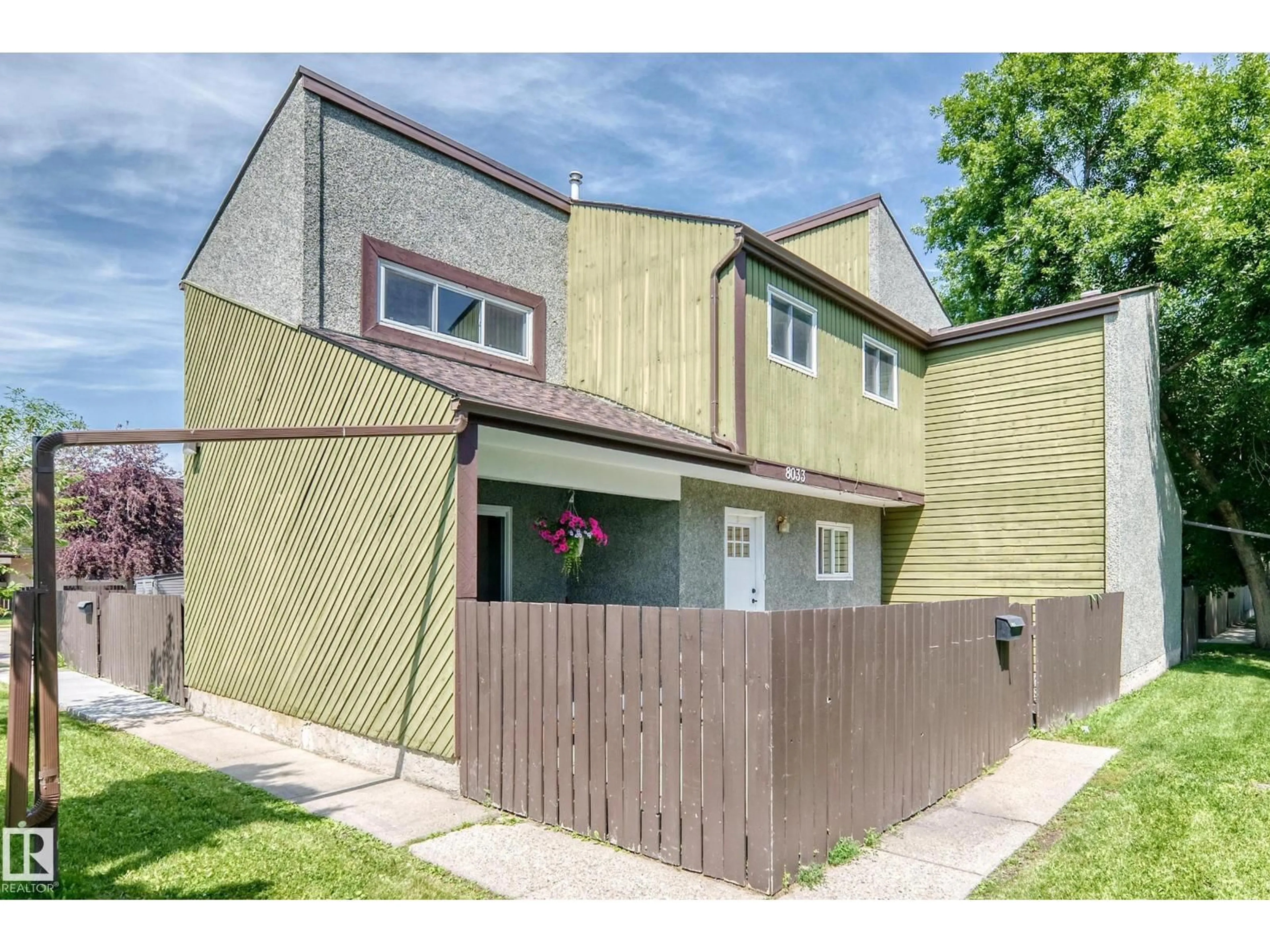 Home with vinyl exterior material, street for 8033 27 AV, Edmonton Alberta T6K3C9