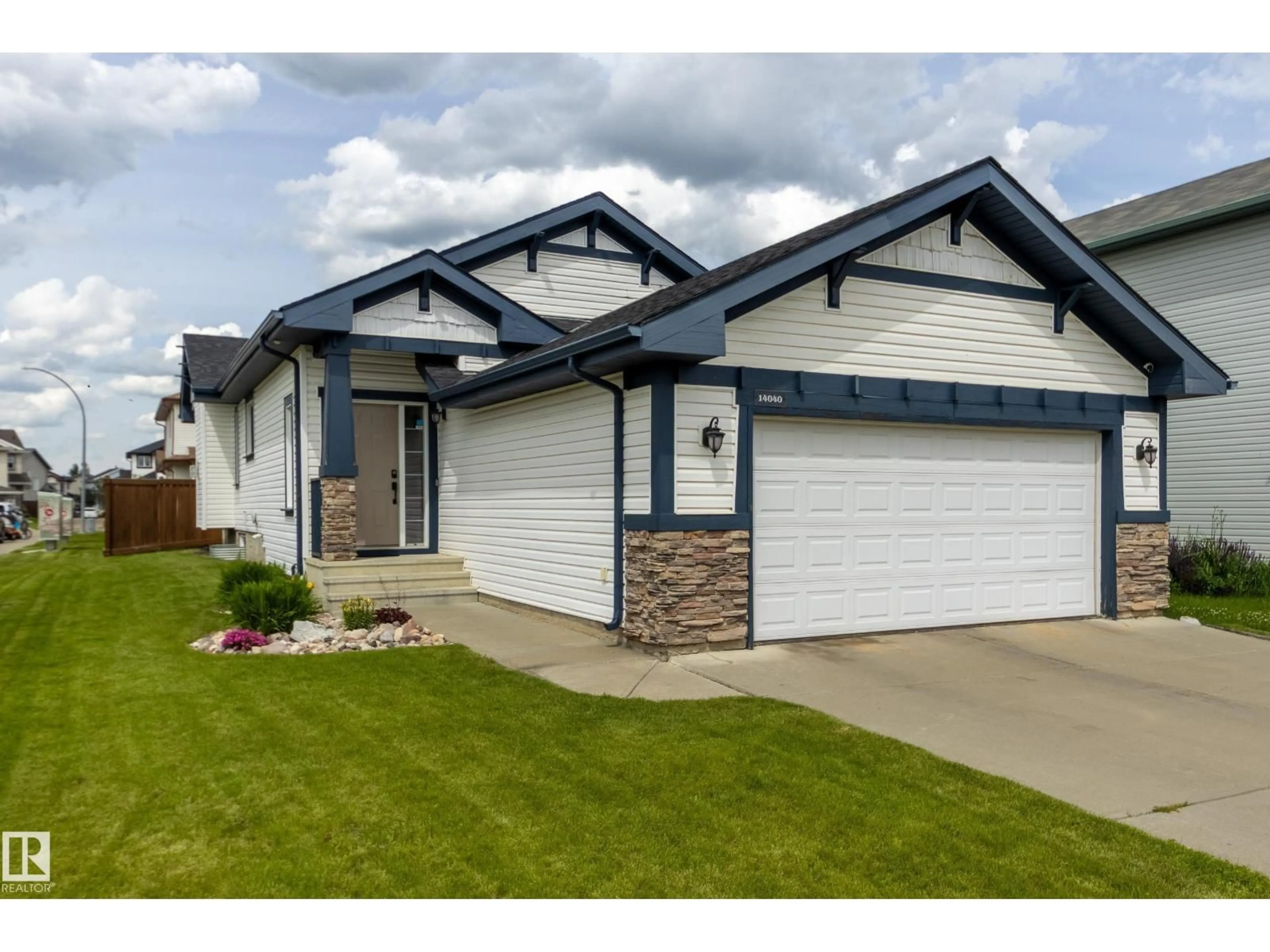 Home with vinyl exterior material, street for 14040 145 AV, Edmonton Alberta T6V1Y2