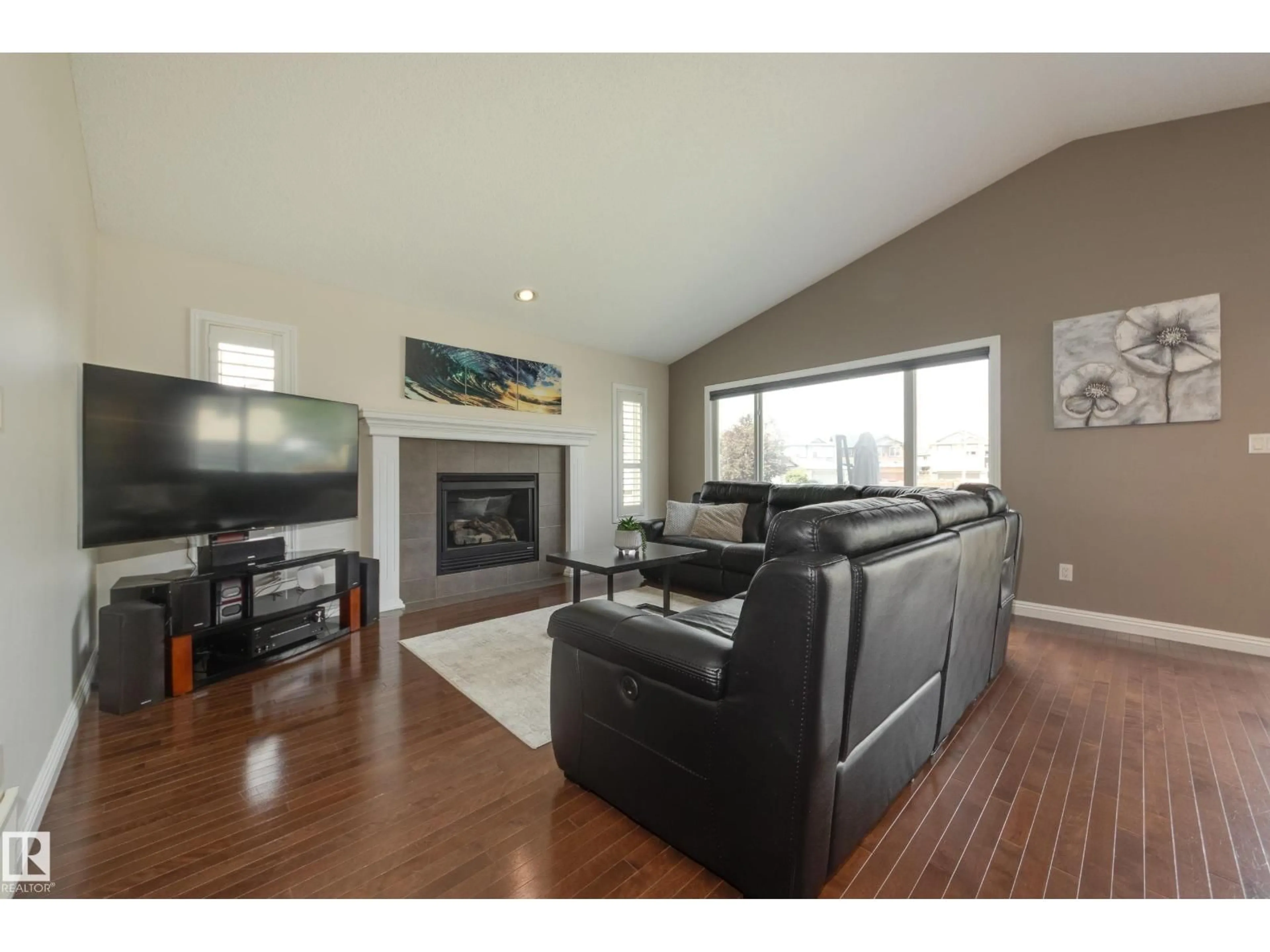 Living room with furniture, wood/laminate floor for 14040 145 AV, Edmonton Alberta T6V1Y2