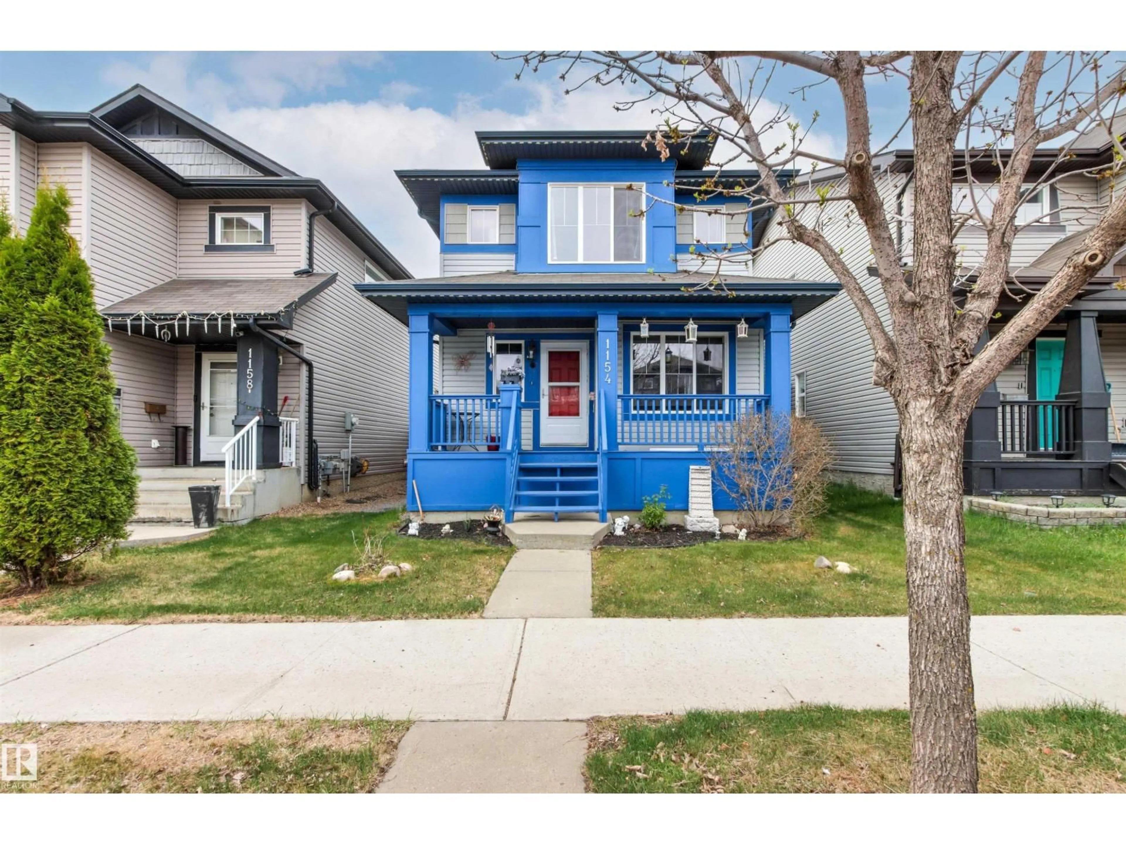 Home with vinyl exterior material, street for 1154 35A AV, Edmonton Alberta T6T0J6