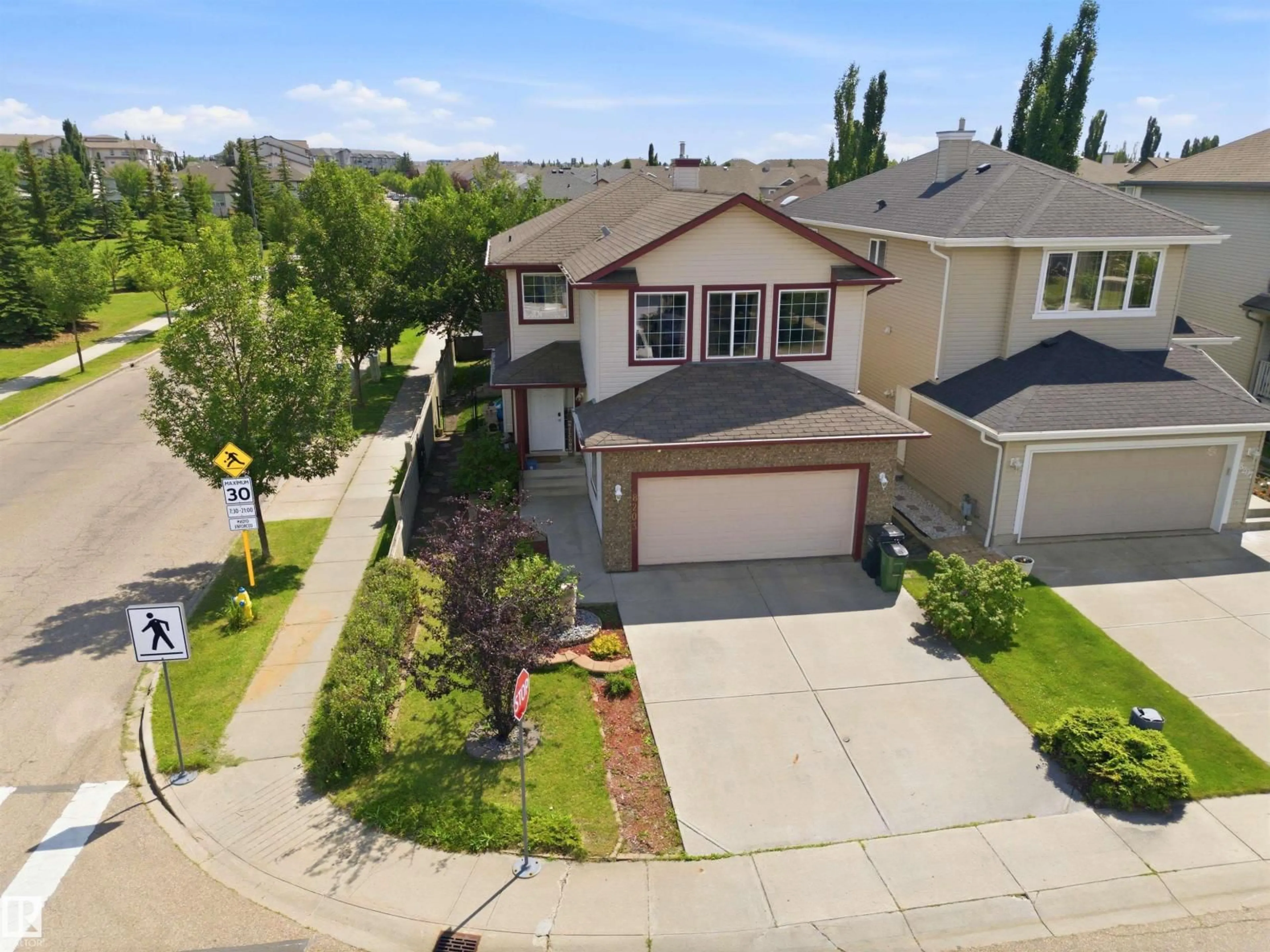 A pic from outside/outdoor area/front of a property/back of a property/a pic from drone, street for 8203 5 AV, Edmonton Alberta T6X1K5