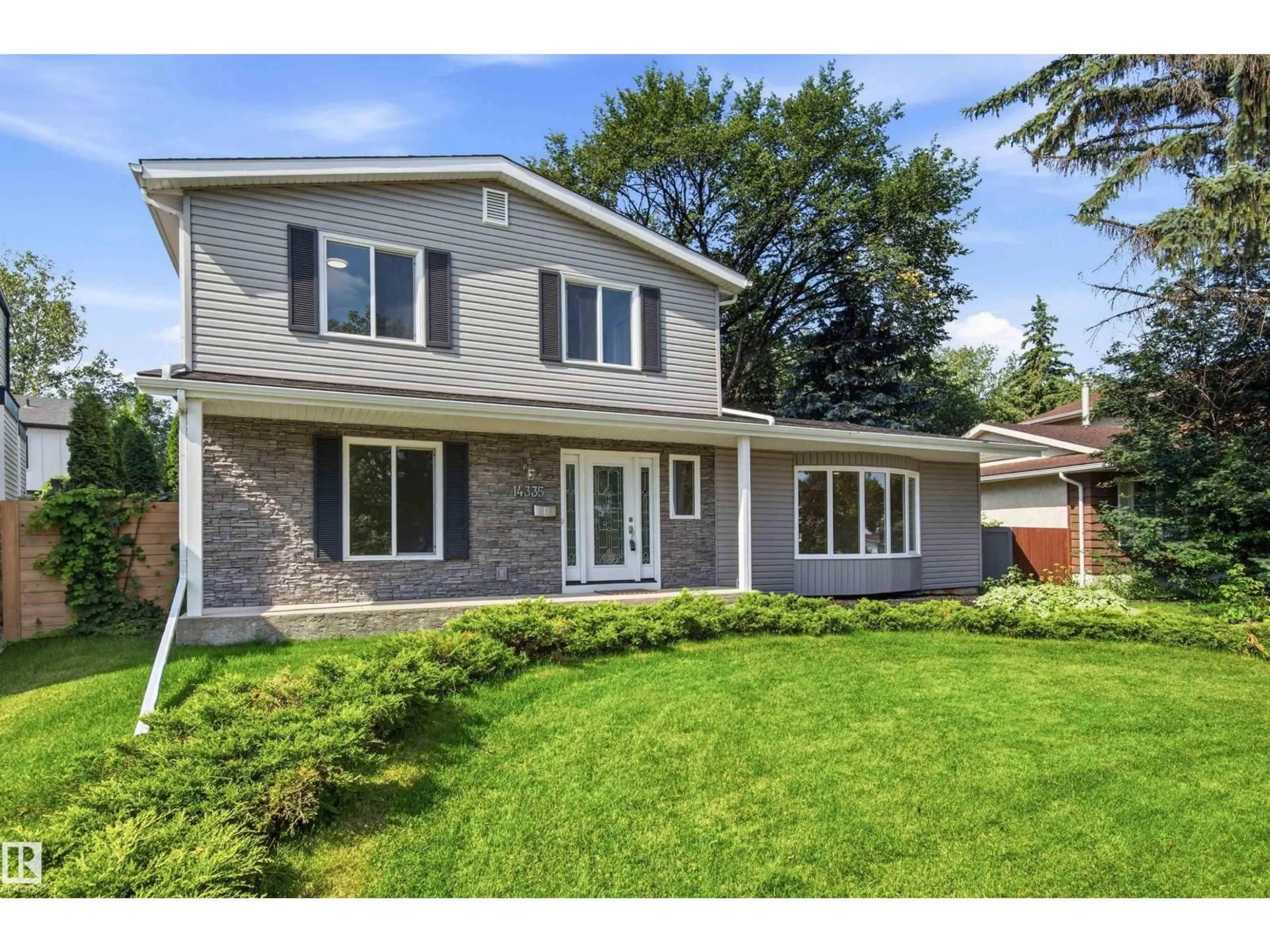 Home with vinyl exterior material, street for 14335 47 AV, Edmonton Alberta T6H0B9