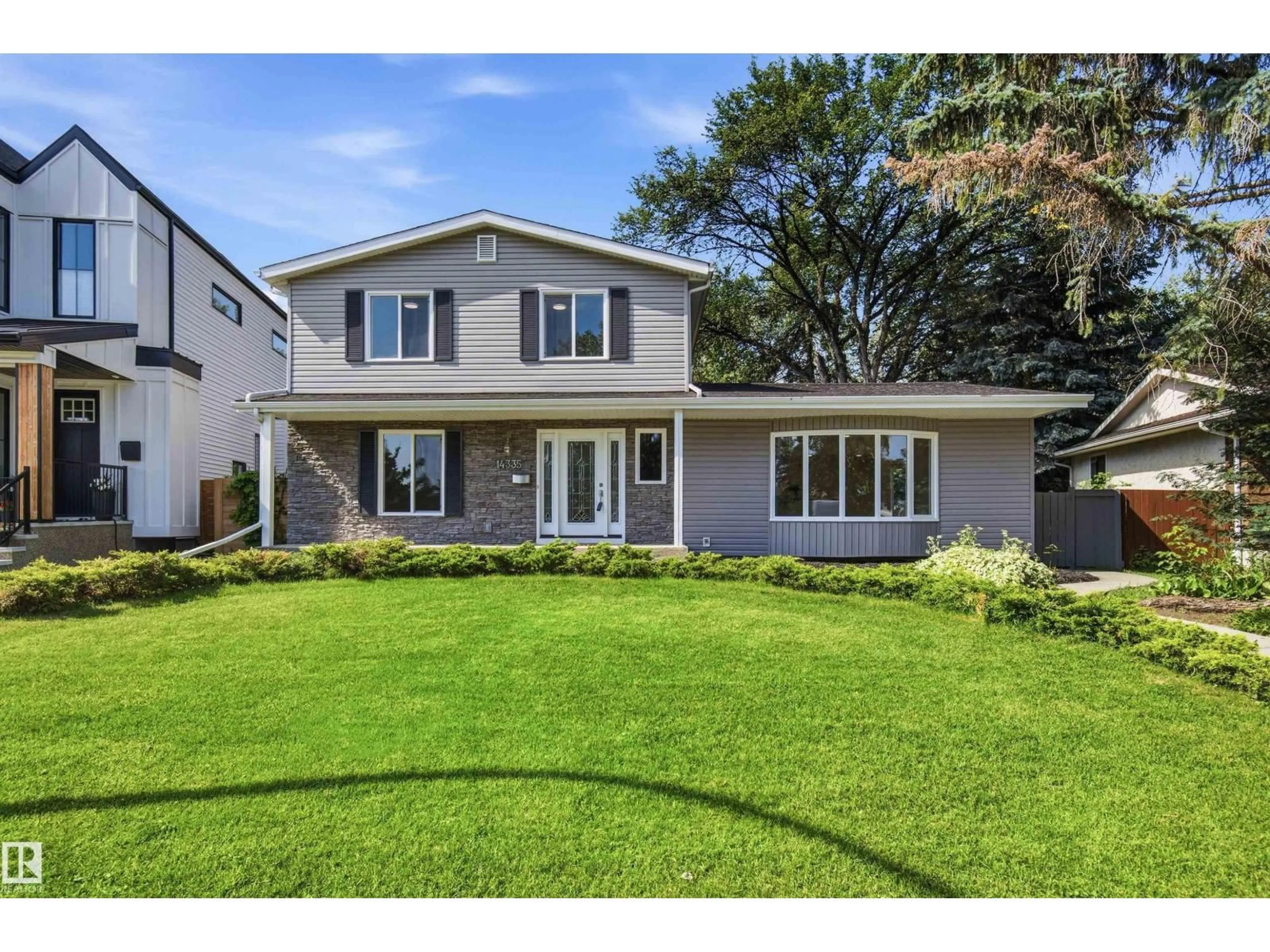 Home with vinyl exterior material, street for 14335 47 AV, Edmonton Alberta T6H0B9