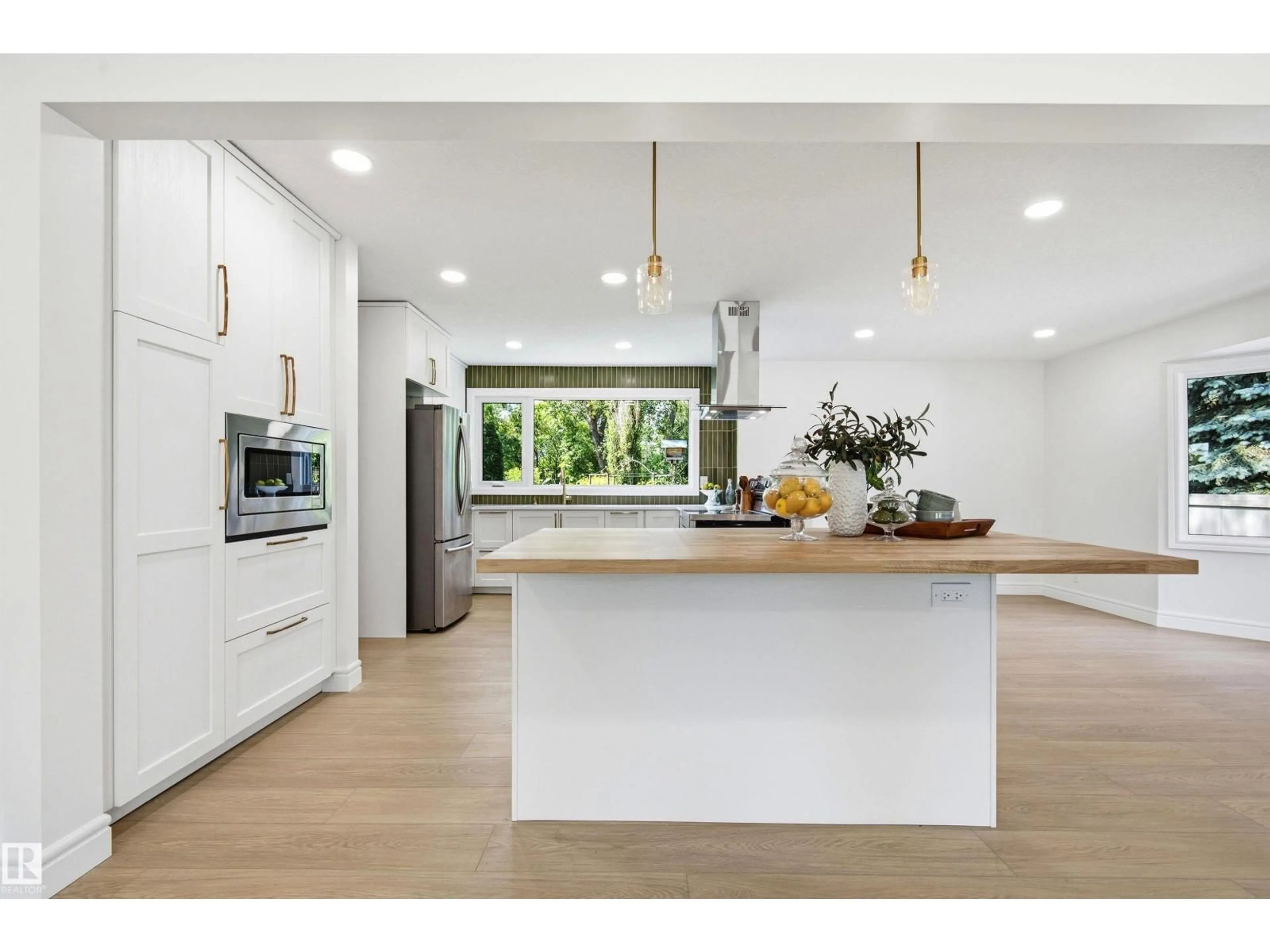 Open concept kitchen, wood/laminate floor for 14335 47 AV, Edmonton Alberta T6H0B9