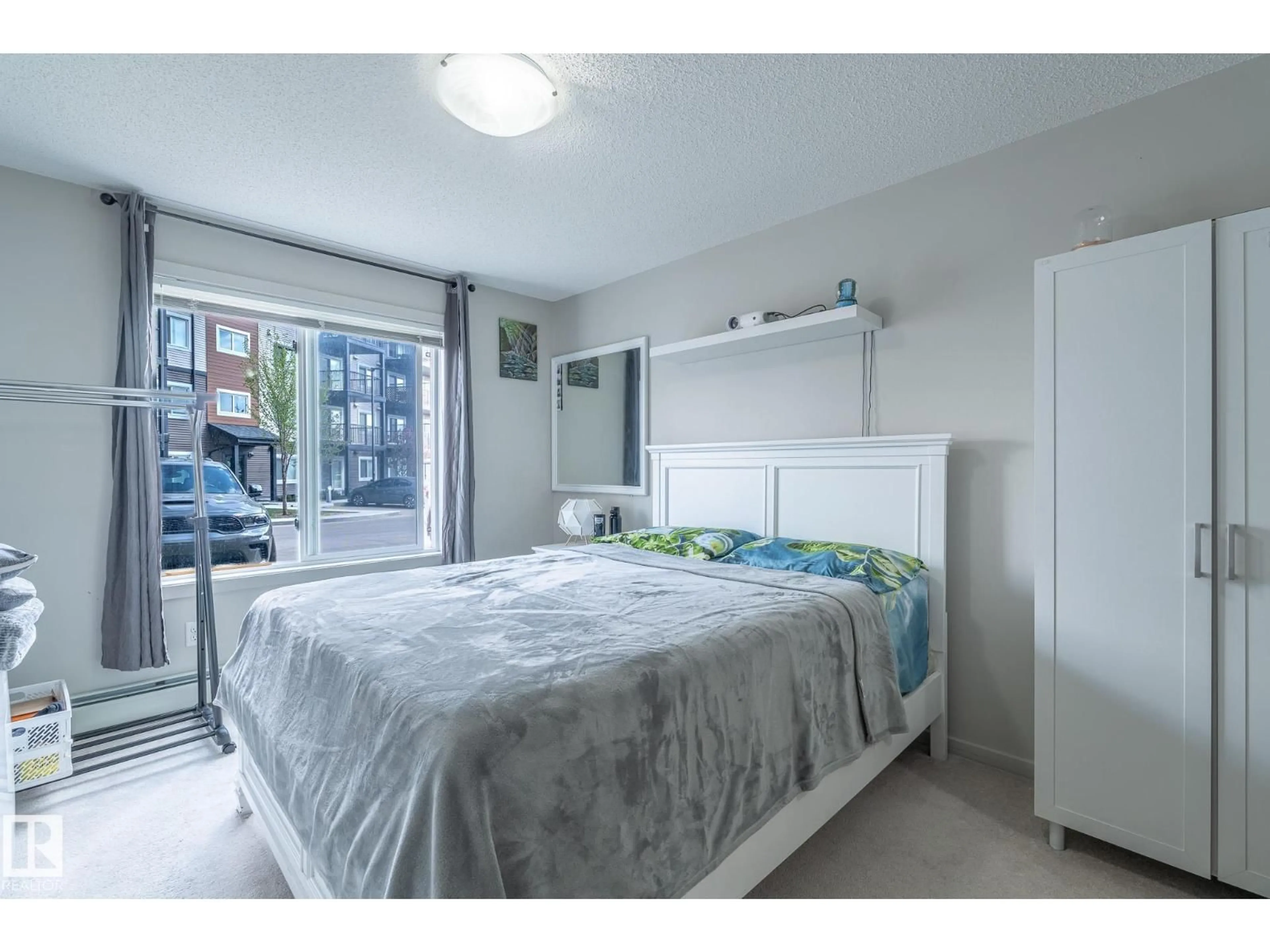 Bedroom with bed, unknown for #107 - 142 EBBERS BV, Edmonton Alberta T5Y3W2