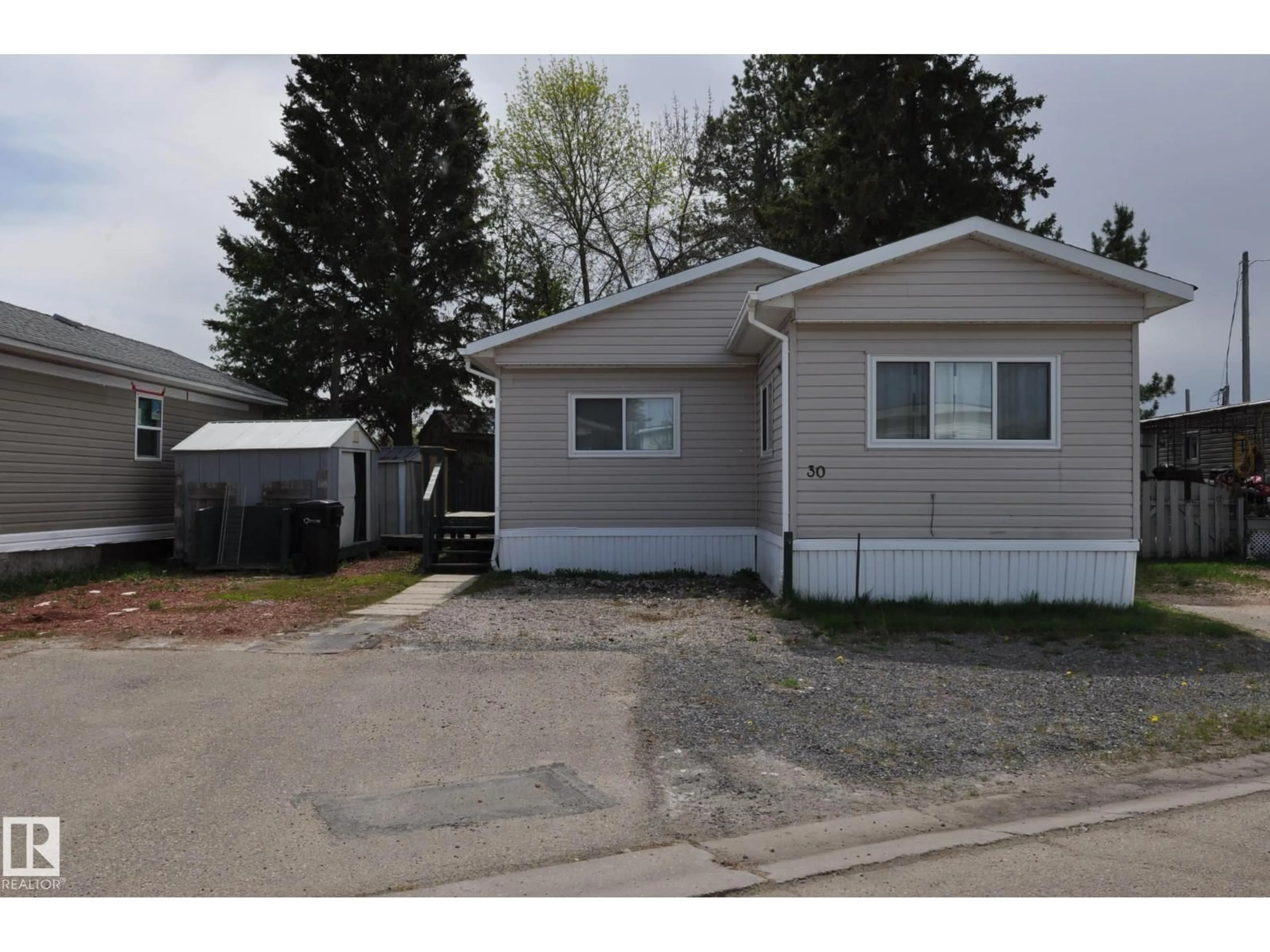 Home with vinyl exterior material, street for 30 10401 101 A ST, Morinville Alberta T8R1B1