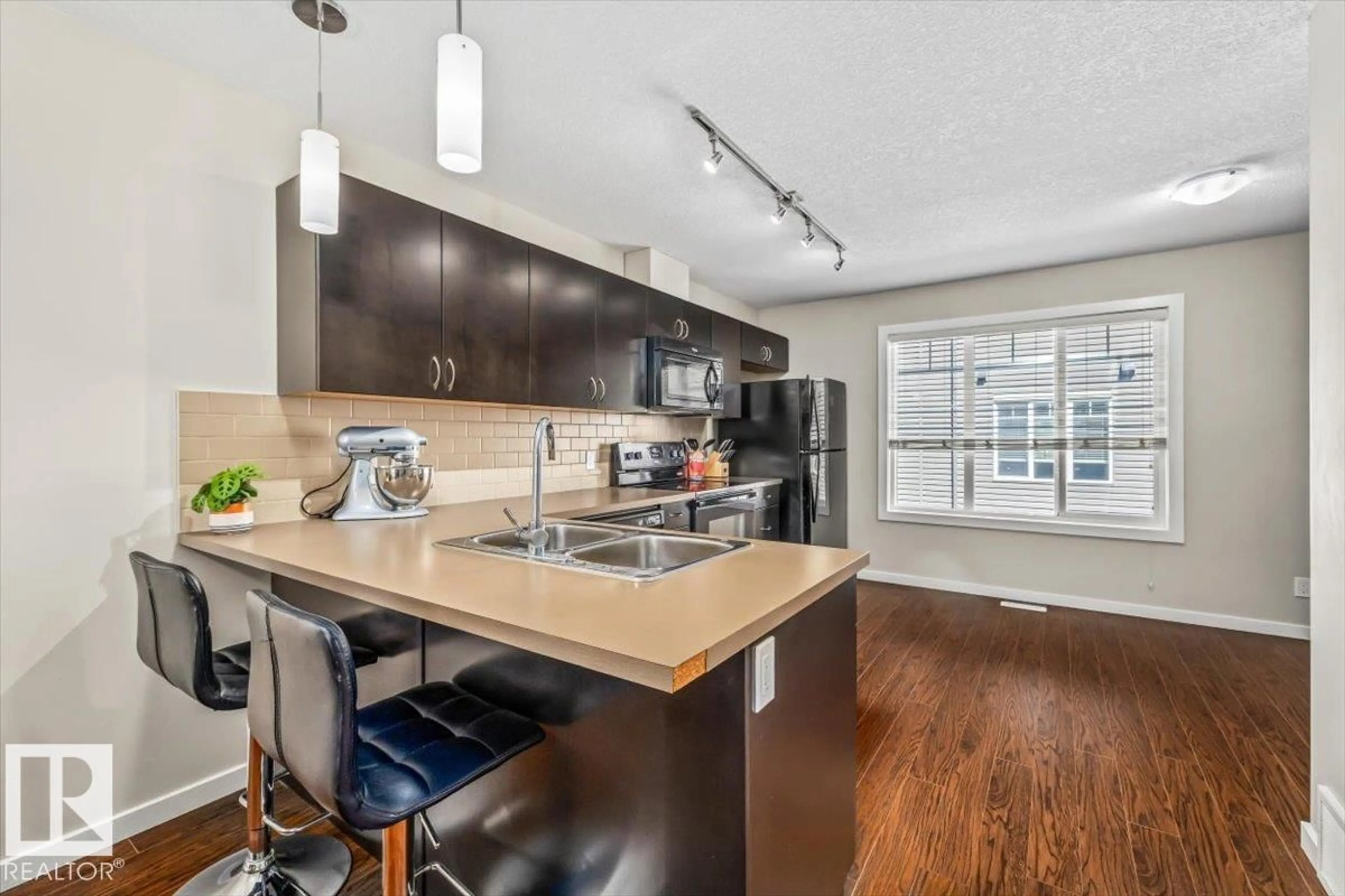 Open concept kitchen, unknown for #40 - 9515 160 AV, Edmonton Alberta T5Z0M4