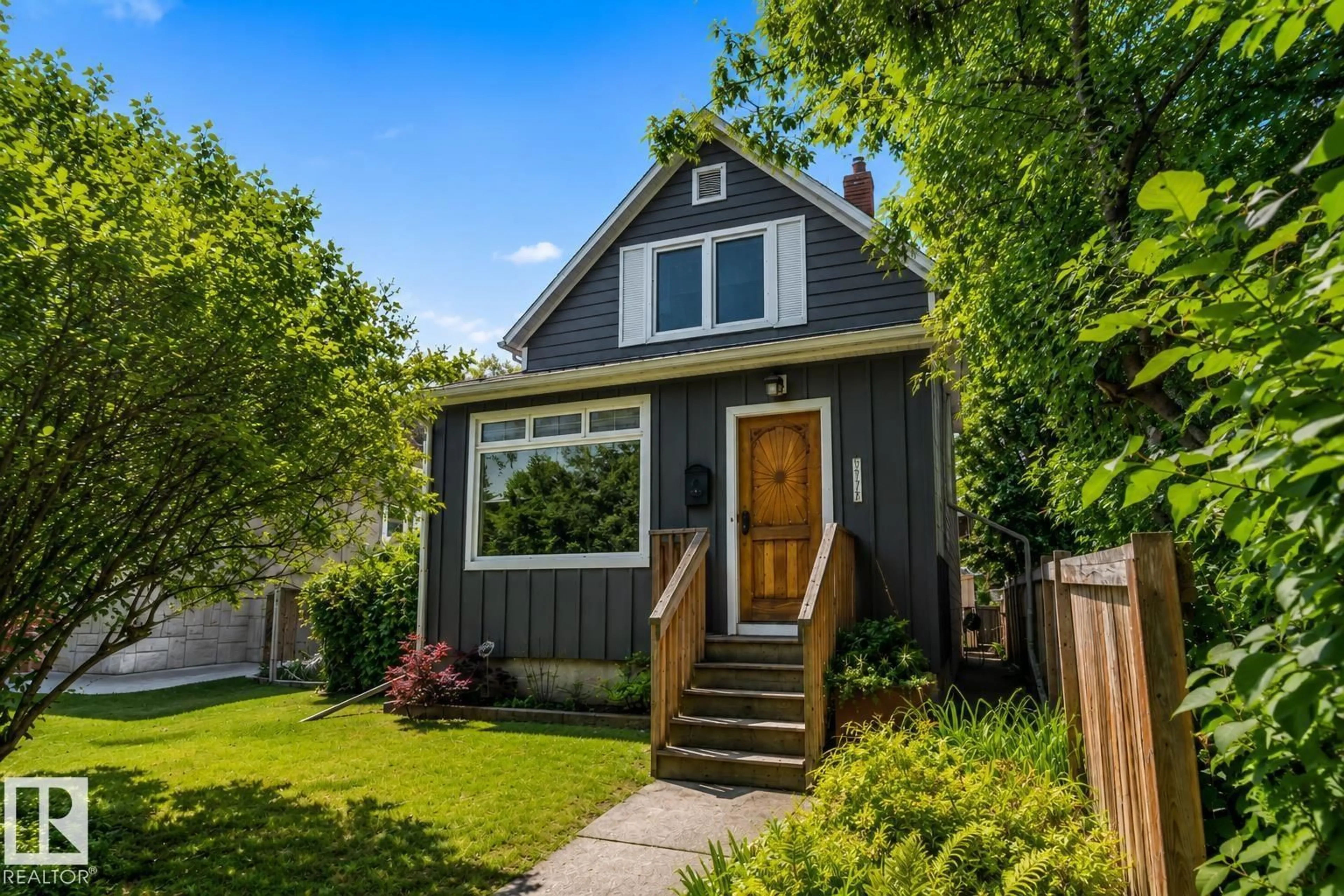 Home with vinyl exterior material, street for 11328 65 ST NW, Edmonton Alberta T5W4K6