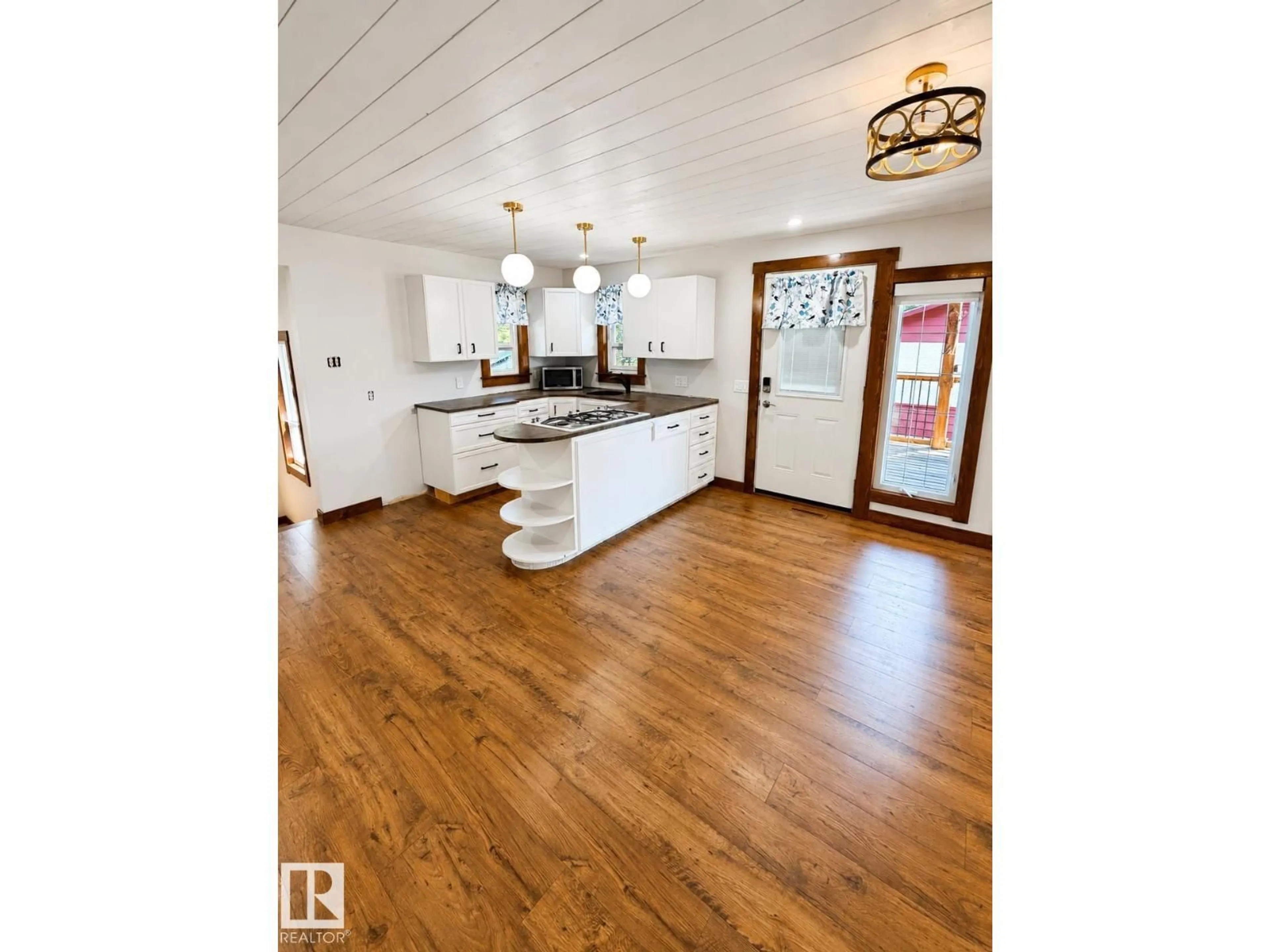 Open concept kitchen, wood/laminate floor for 610 8 AV, Wainwright Alberta T9W1B4