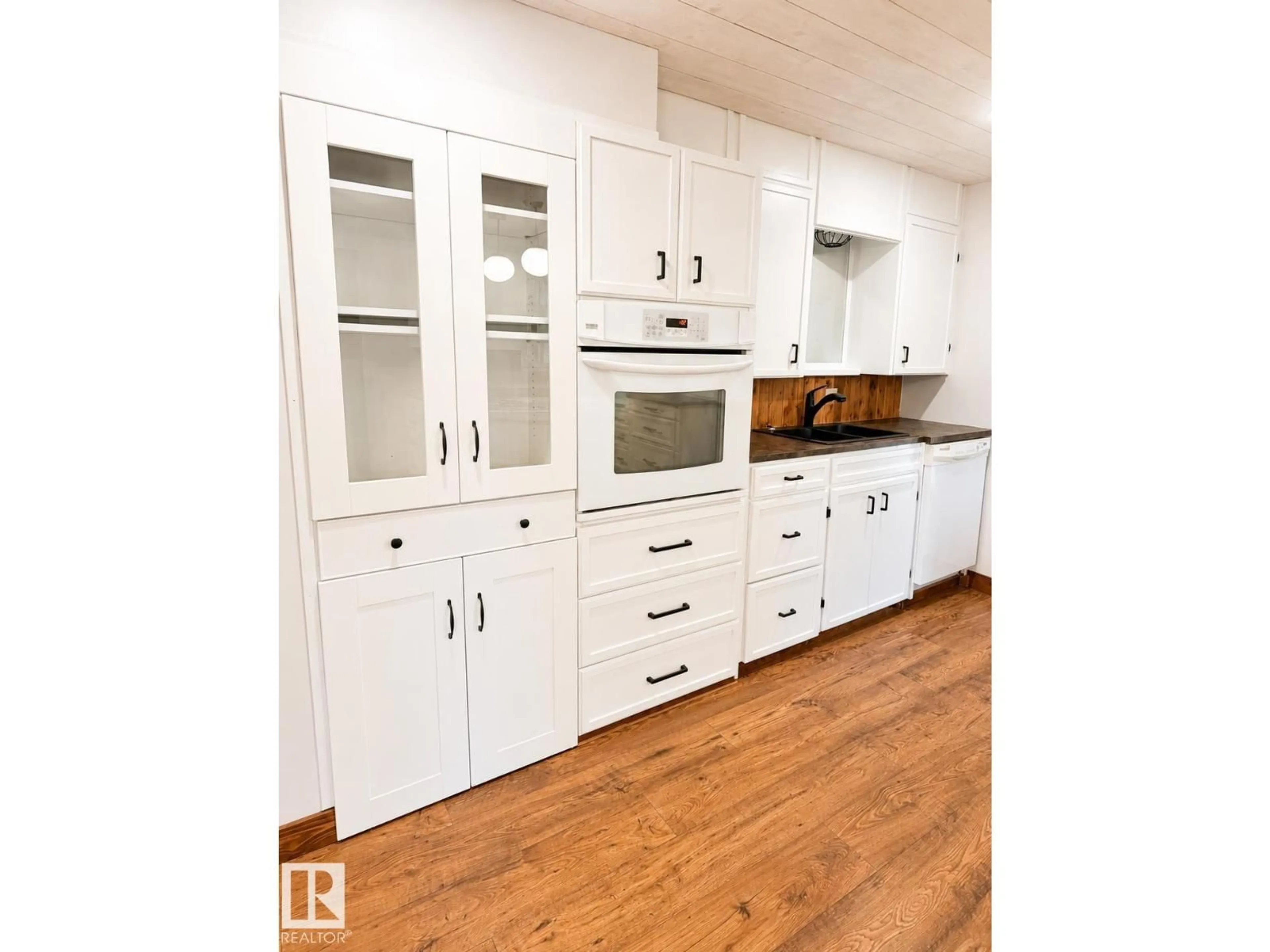 Open concept kitchen, wood/laminate floor for 610 8 AV, Wainwright Alberta T9W1B4
