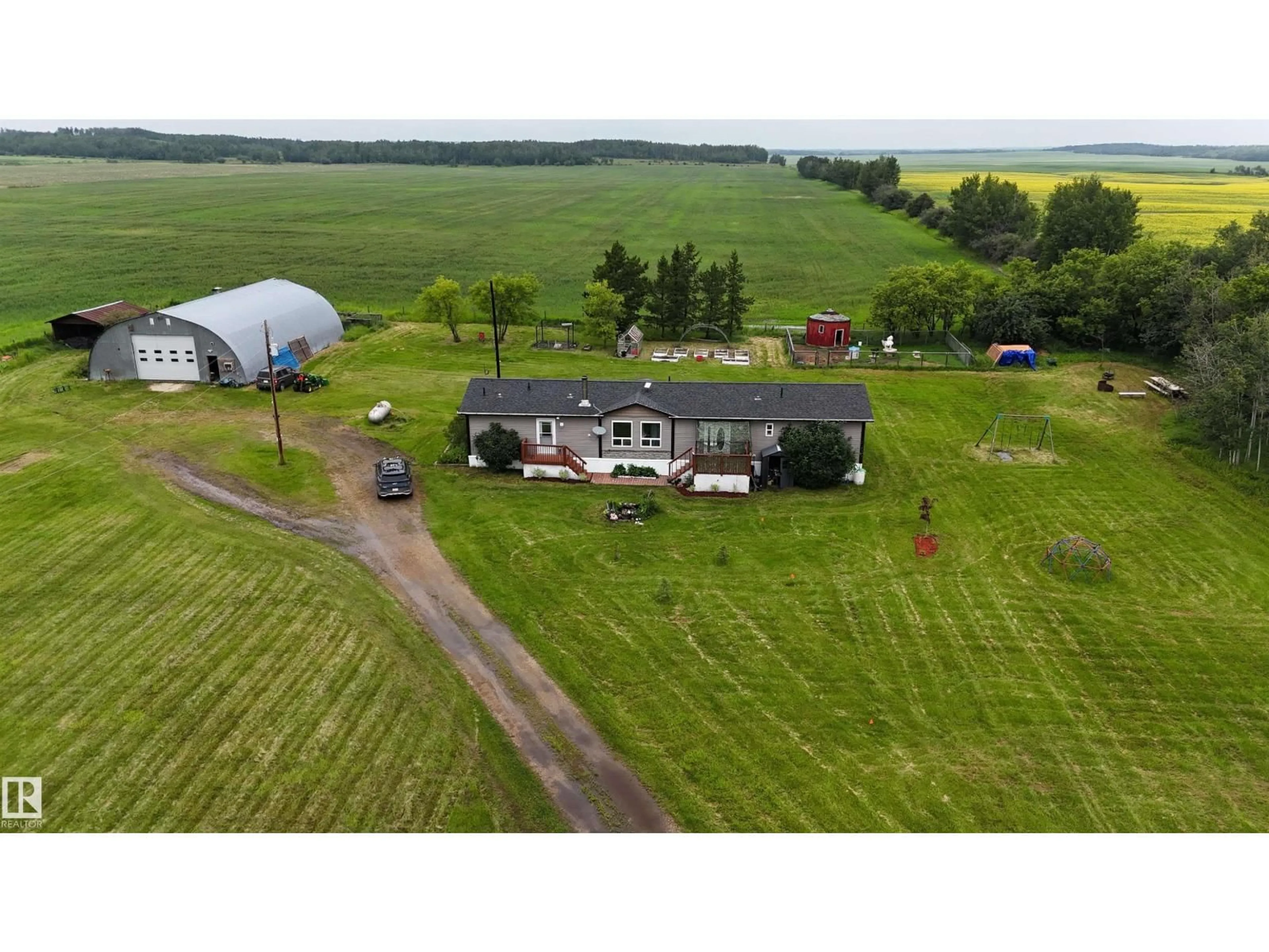 A pic from outside/outdoor area/front of a property/back of a property/a pic from drone, unknown for 27418 TWP ROAD 552, Rural Sturgeon County Alberta T8R2E8