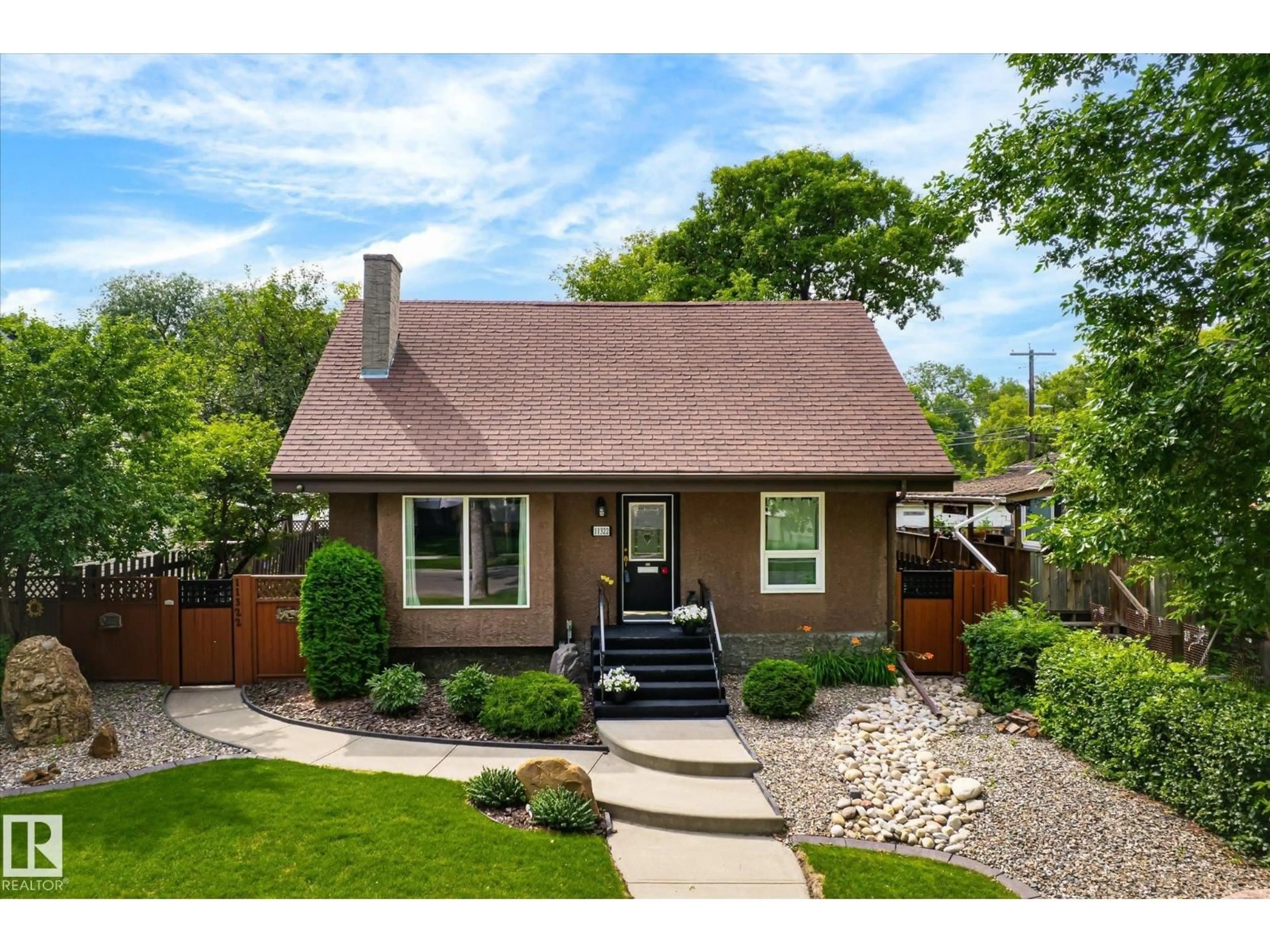 Home with brick exterior material, street for NW - 11322 56 ST, Edmonton Alberta T5W3S4