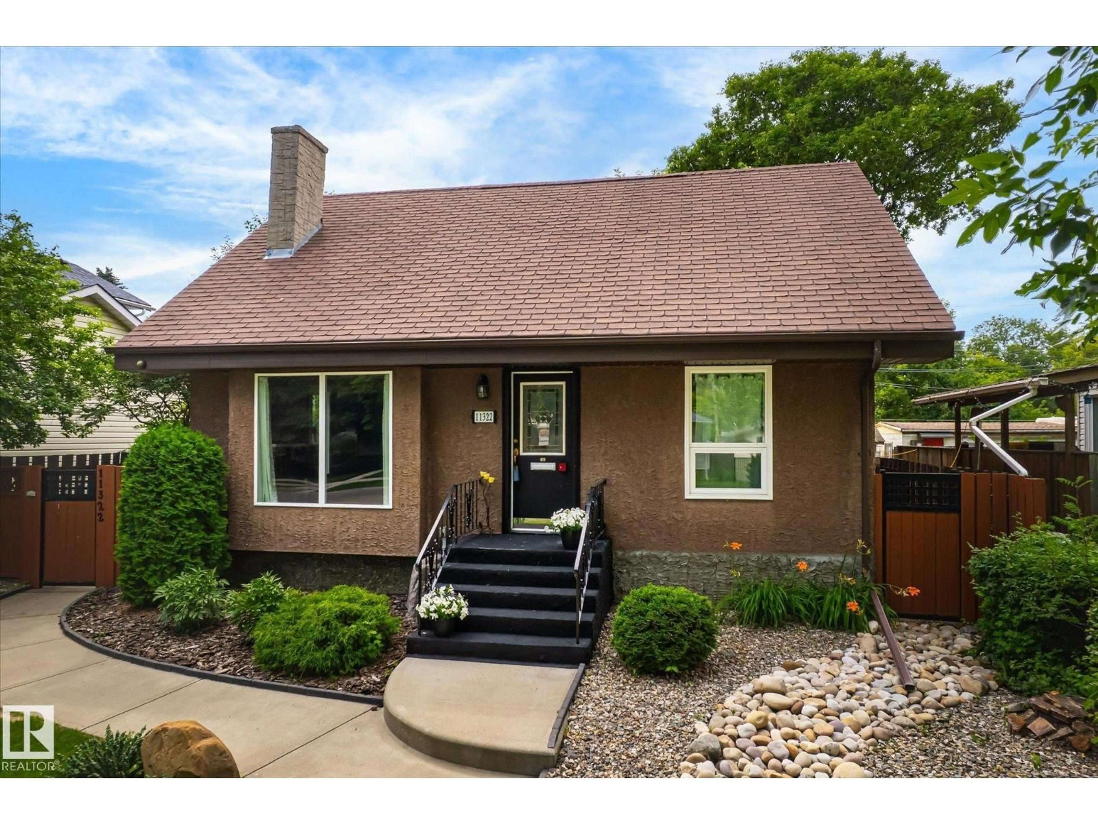 Home with brick exterior material, street for NW - 11322 56 ST, Edmonton Alberta T5W3S4