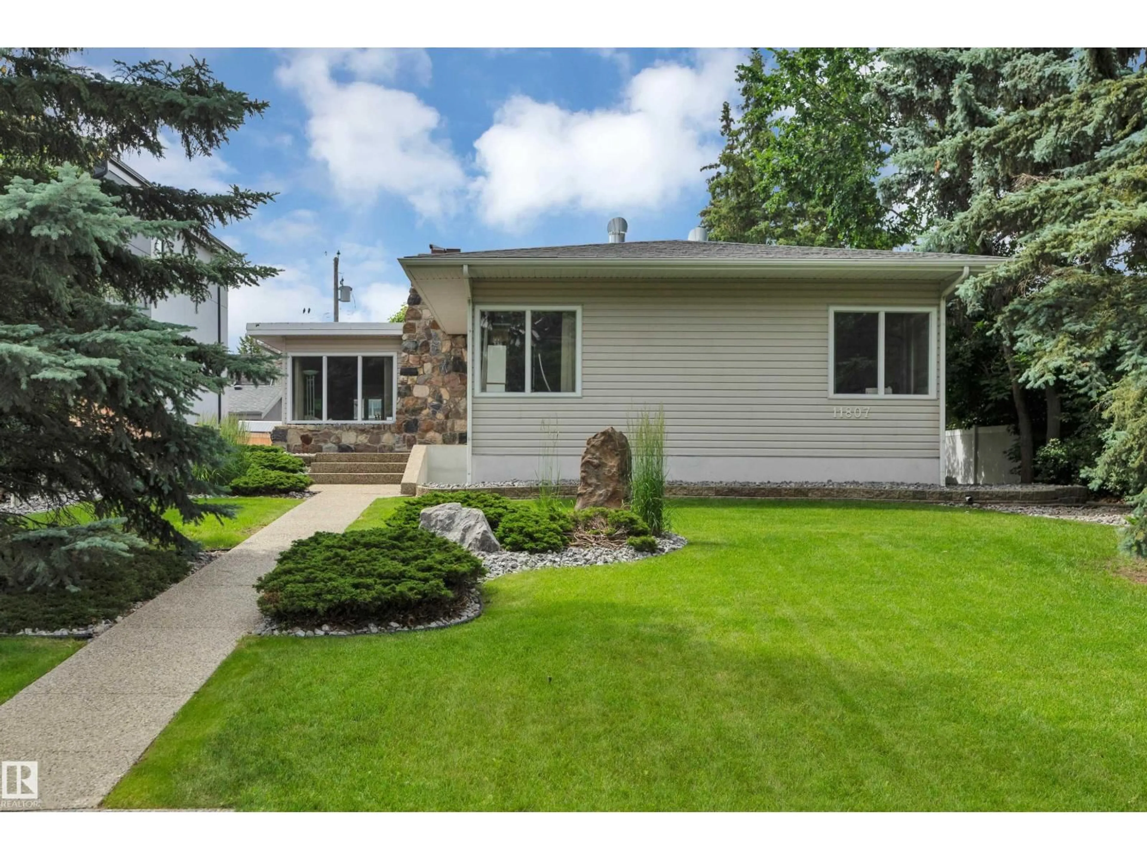 Home with vinyl exterior material, street for 11807 91 AV, Edmonton Alberta T6G1B1