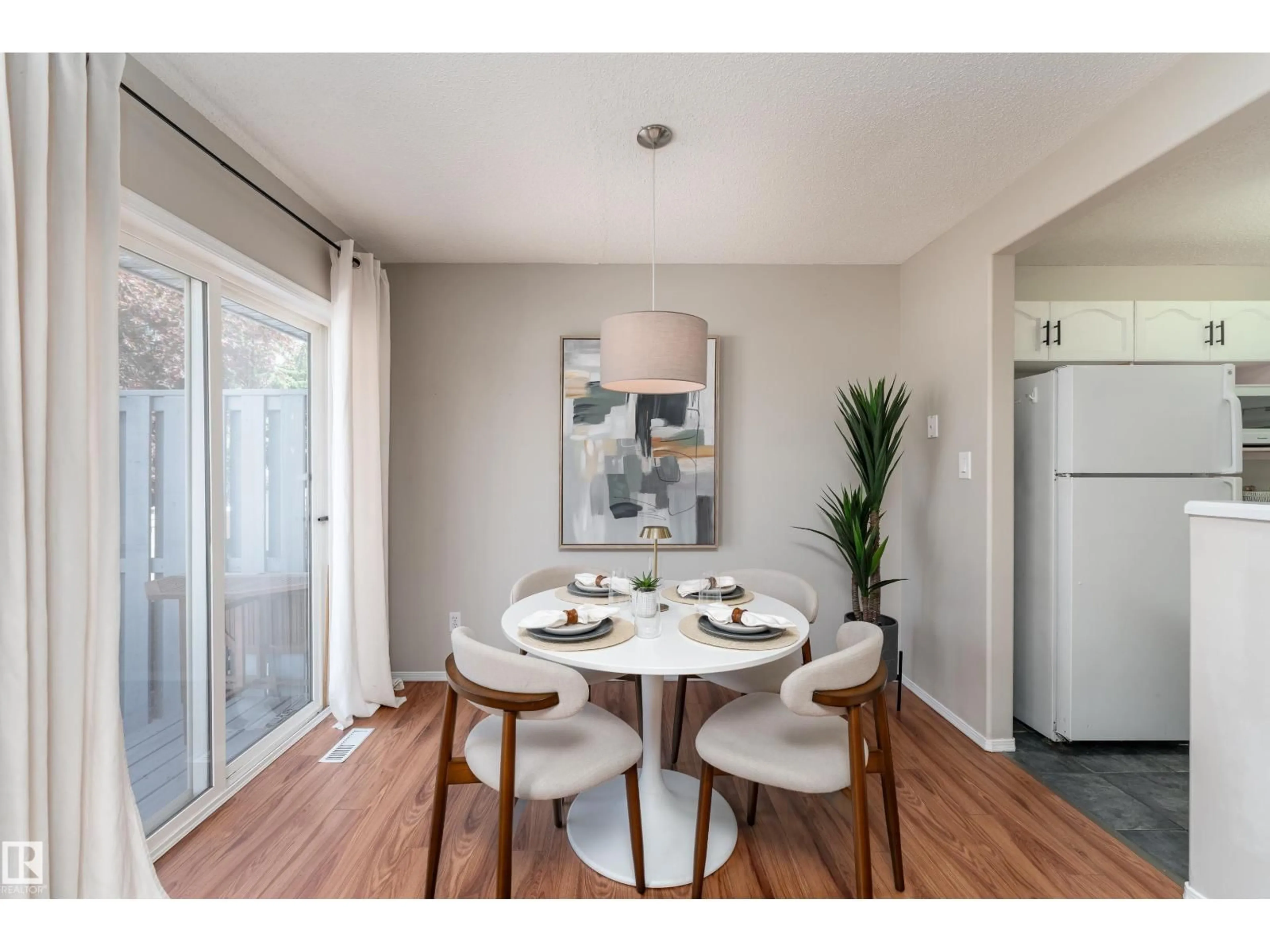 Dining room, wood/laminate floor for 121 BULYEA RD, Edmonton Alberta T6R2M9