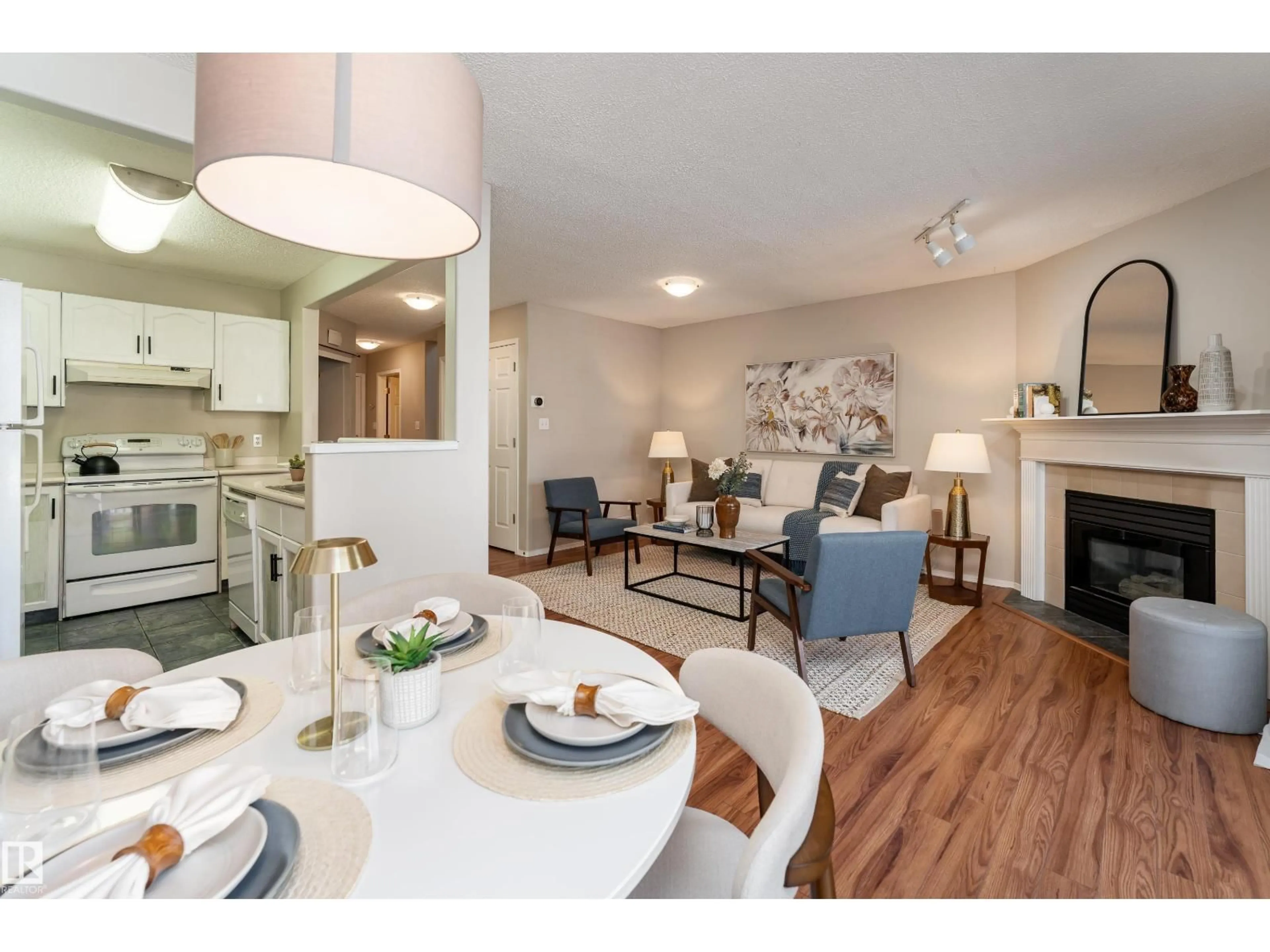 Living room with furniture, wood/laminate floor for 121 BULYEA RD, Edmonton Alberta T6R2M9