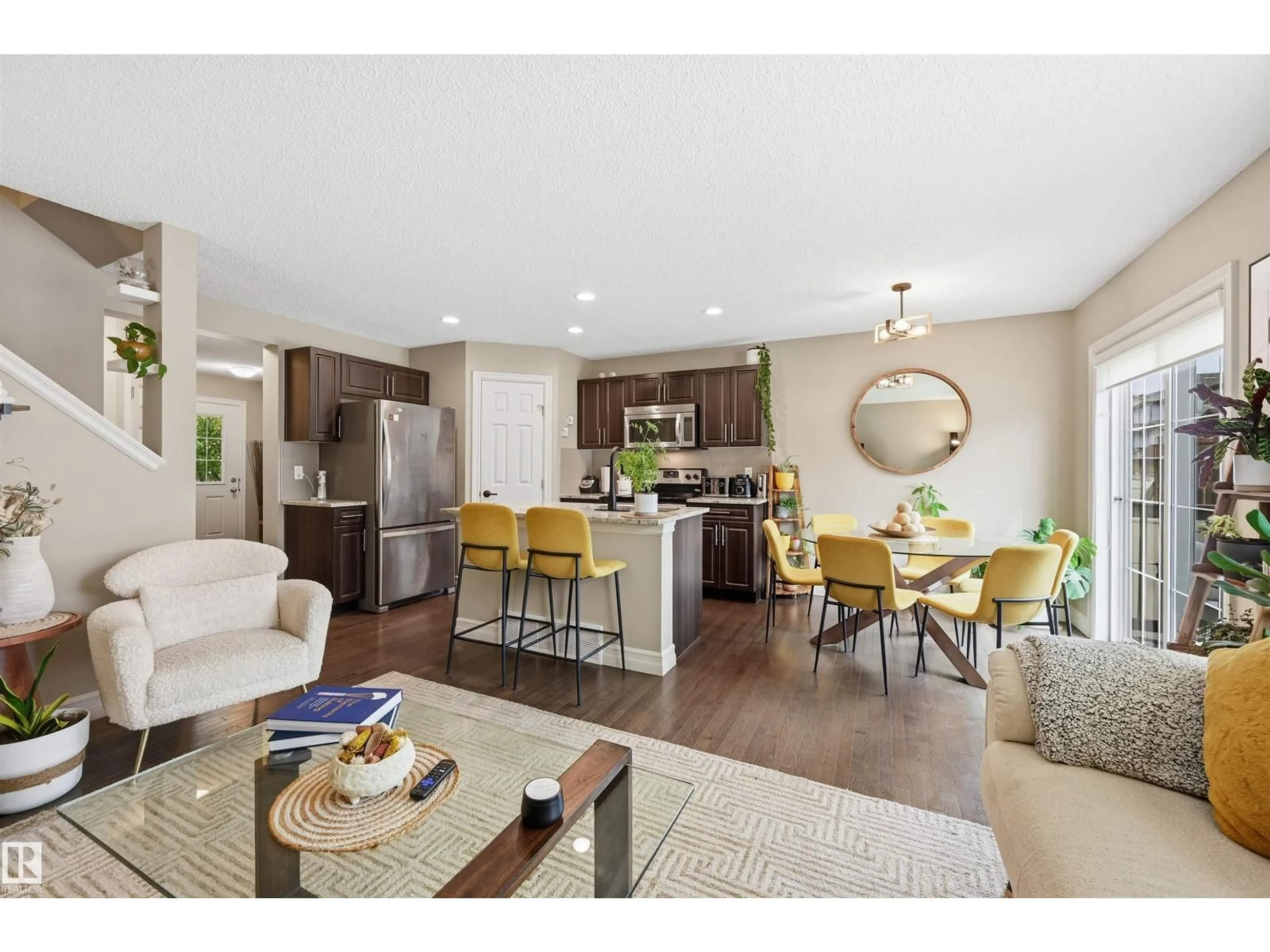 Open concept kitchen, wood/laminate floor for #11 - 5317 3 AV SW, Edmonton Alberta T6X0W7