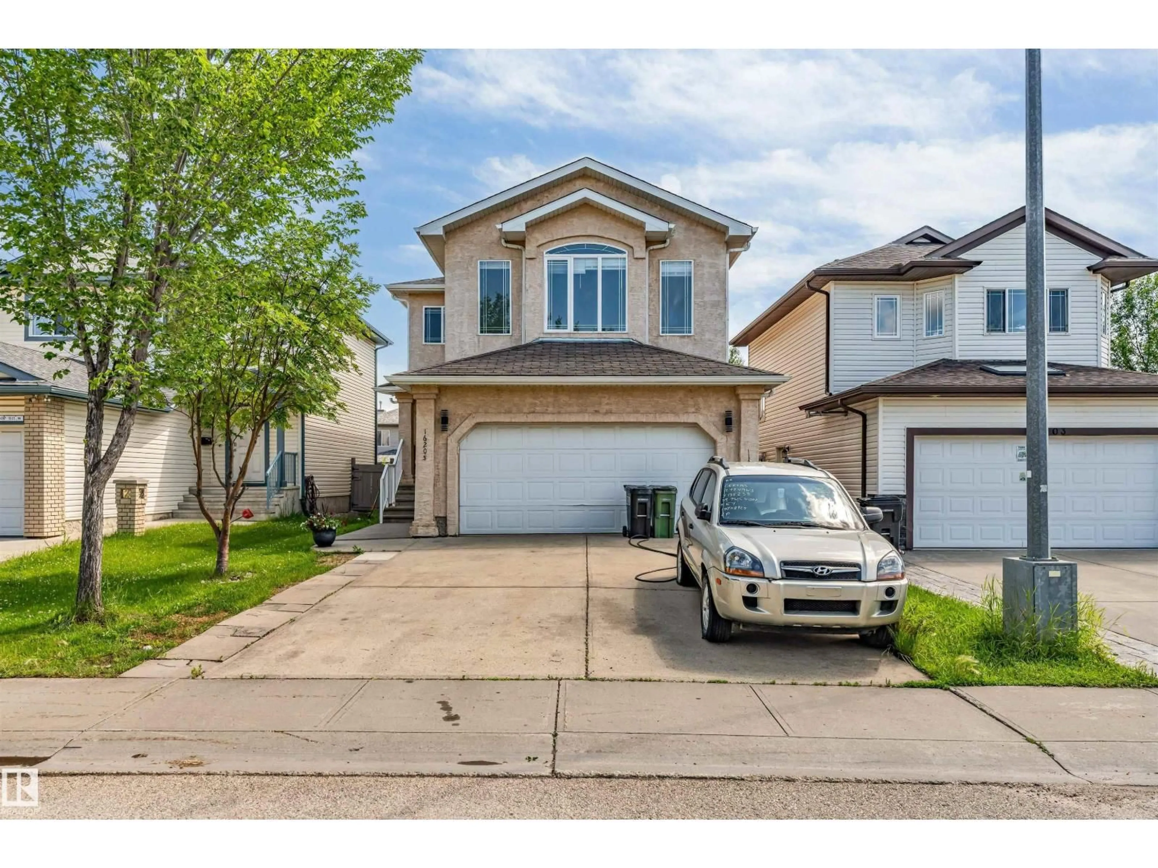 Home with vinyl exterior material, street for 16205 55 ST, Edmonton Alberta T5Y0G1