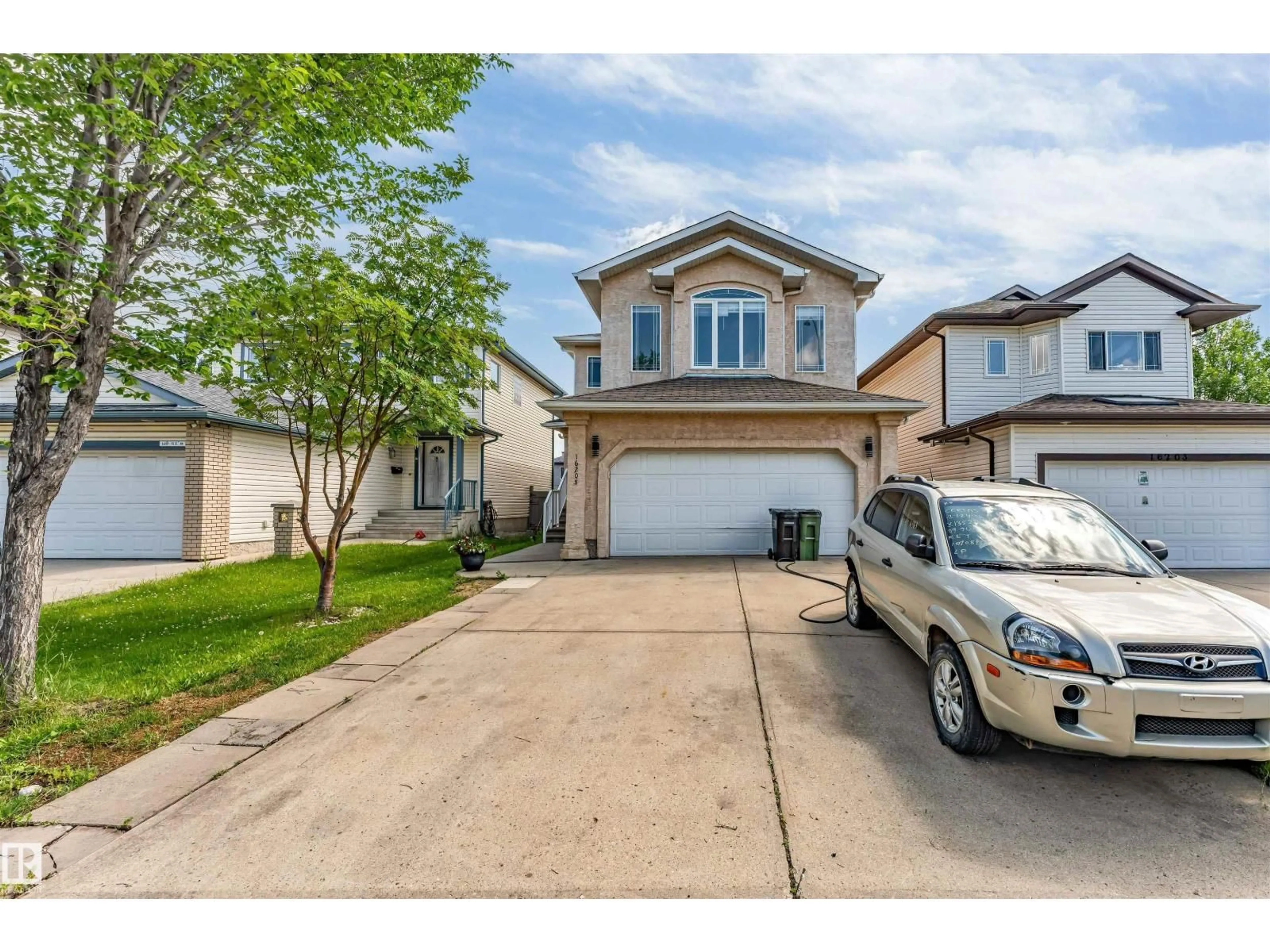 Home with vinyl exterior material, street for 16205 55 ST, Edmonton Alberta T5Y0G1