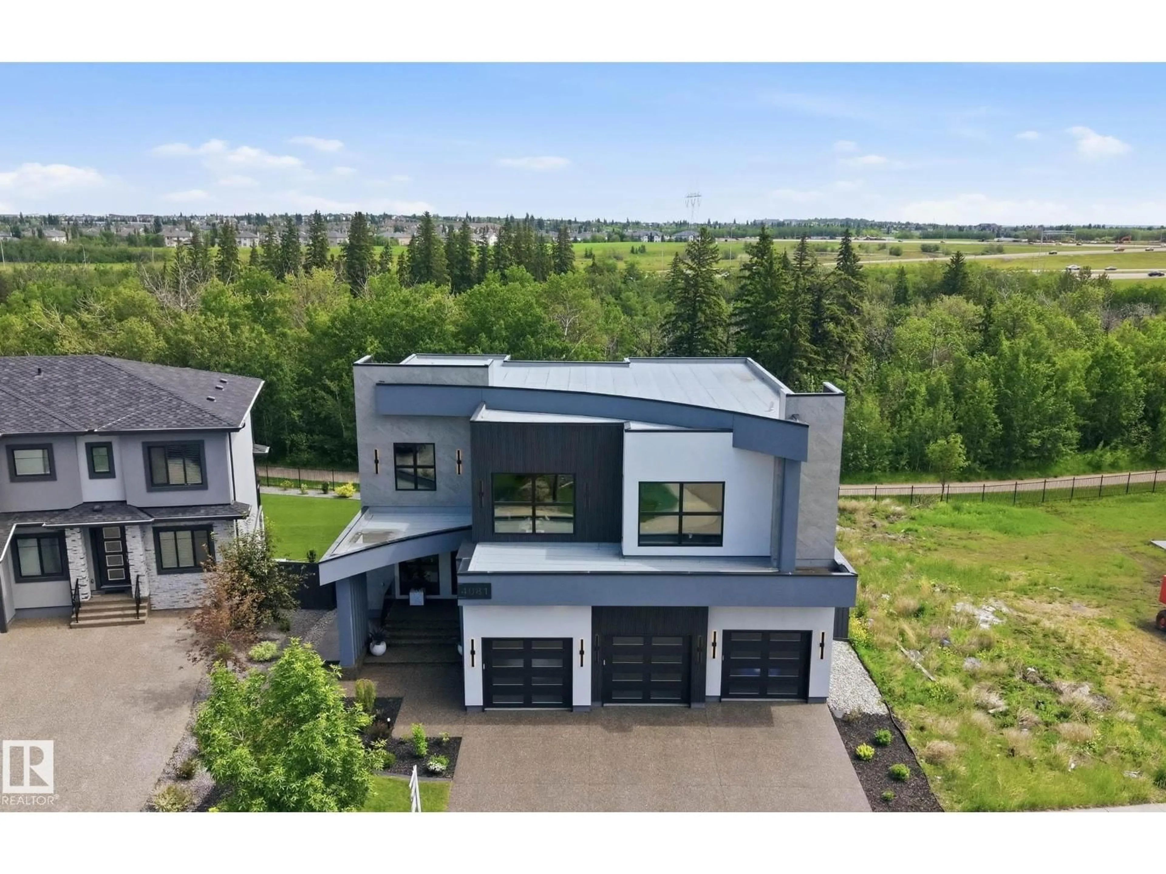 A pic from outside/outdoor area/front of a property/back of a property/a pic from drone, building for 4081 WHISPERING RIVER DR, Edmonton Alberta T6W2E2