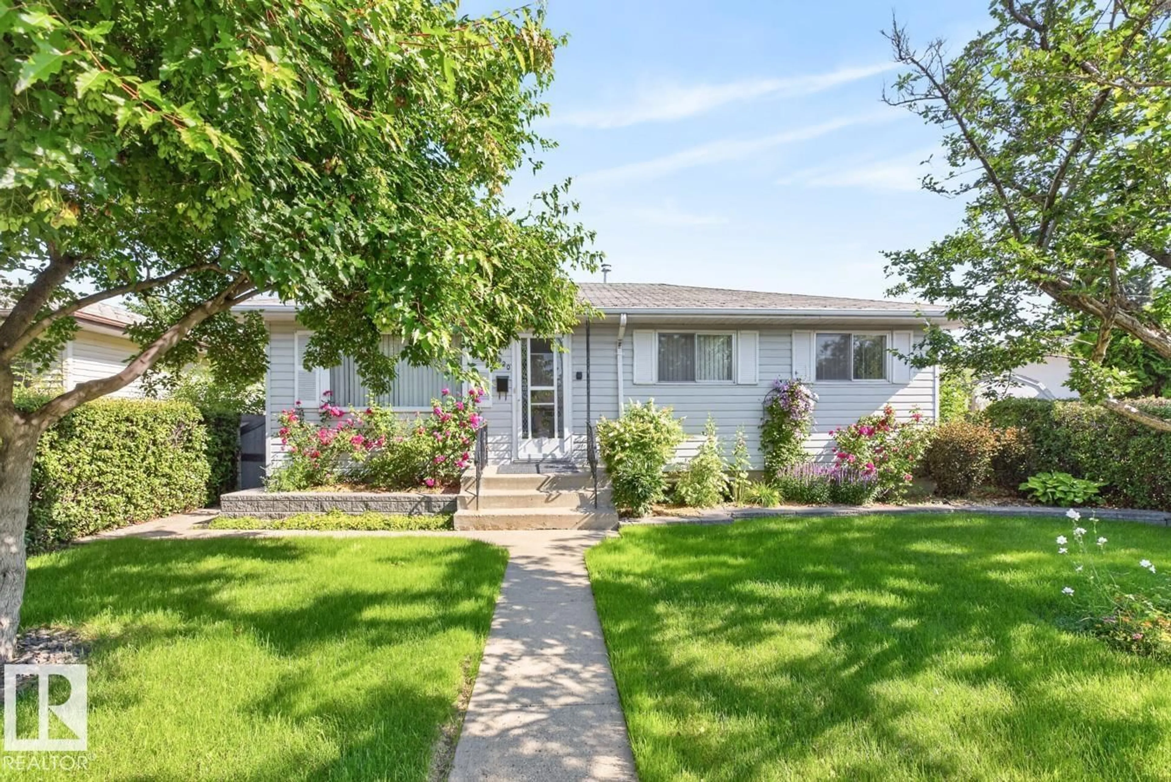 Home with vinyl exterior material, street for 11820 132 AV, Edmonton Alberta T5E1A7