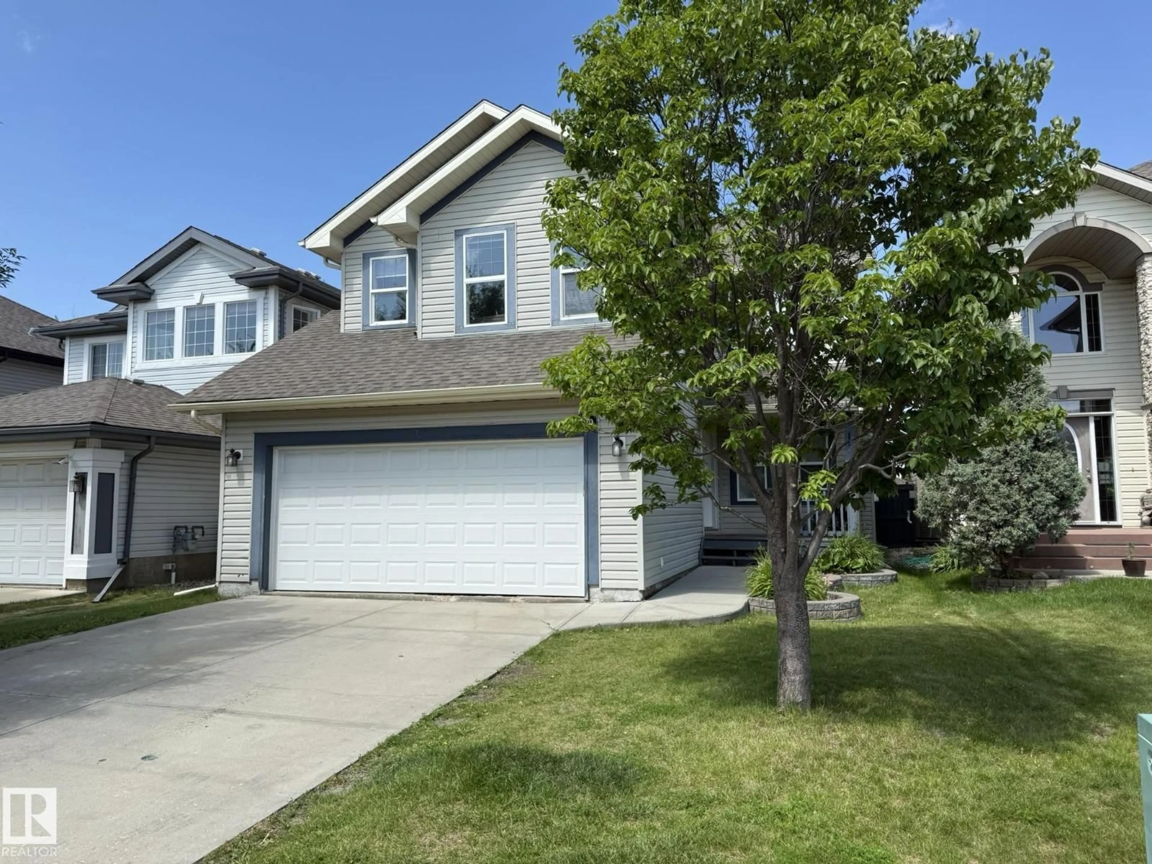 Home with vinyl exterior material, street for 1820 ROBERTSON CR, Edmonton Alberta T6W1N8