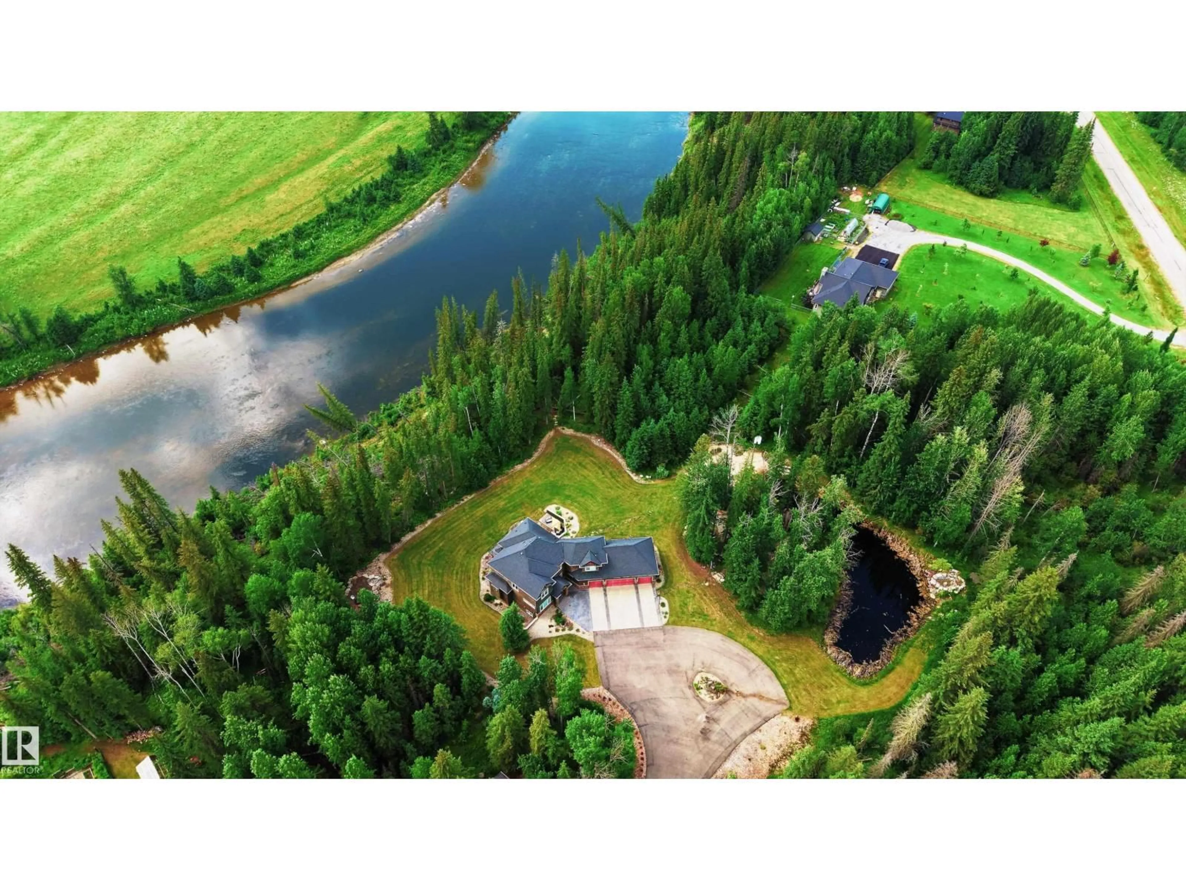 A pic from outside/outdoor area/front of a property/back of a property/a pic from drone, water/lake/river/ocean view for #4 - 165111 TOWNSHIP ROAD 532A, Rural Yellowhead Alberta T7E3A6