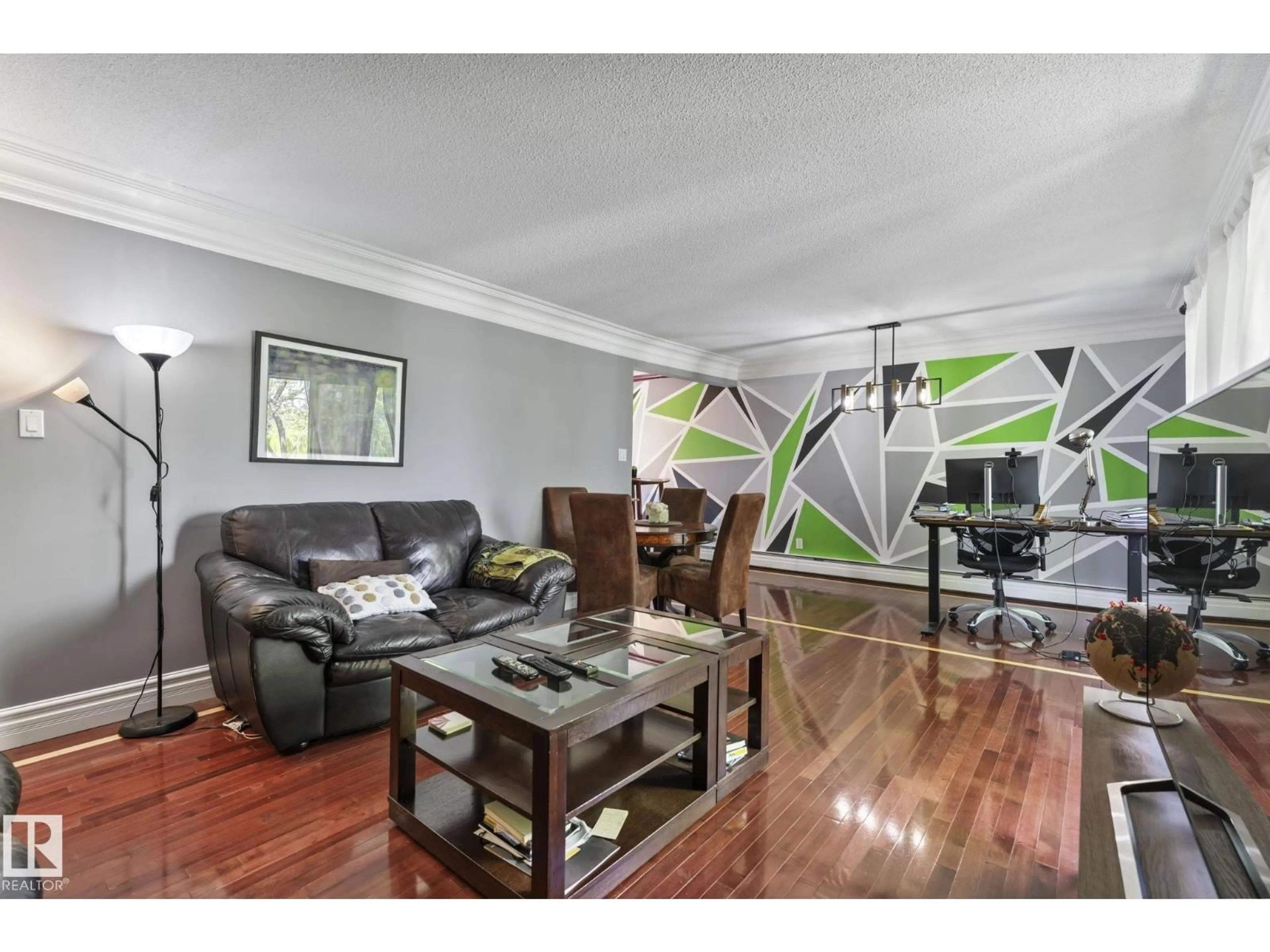 Living room with furniture, wood/laminate floor for 405 - 10745 83 AV, Edmonton Alberta T6E2E5