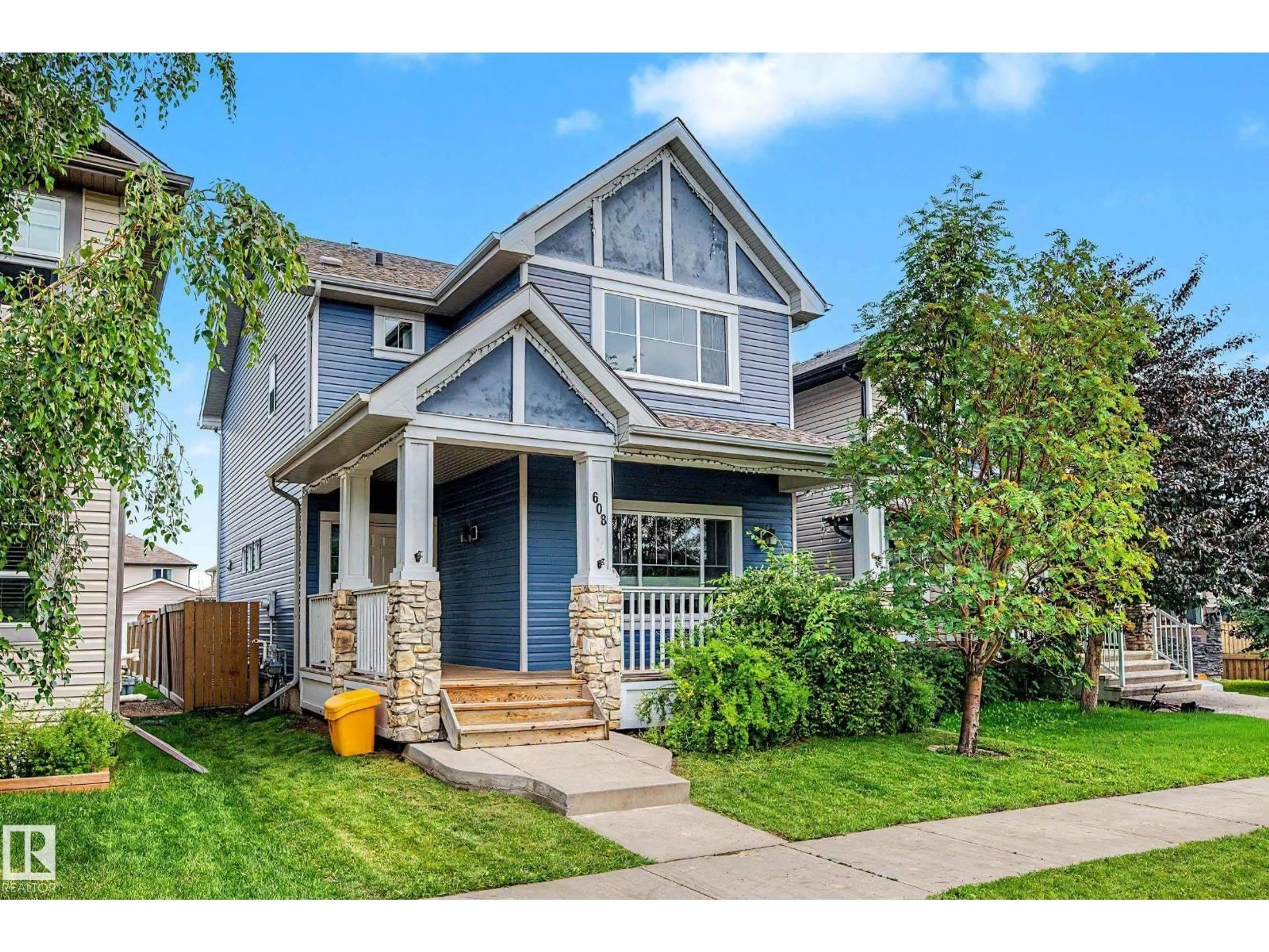 Home with vinyl exterior material, street for 608 MCDONOUGH LI NW, Edmonton Alberta T5Y0M8