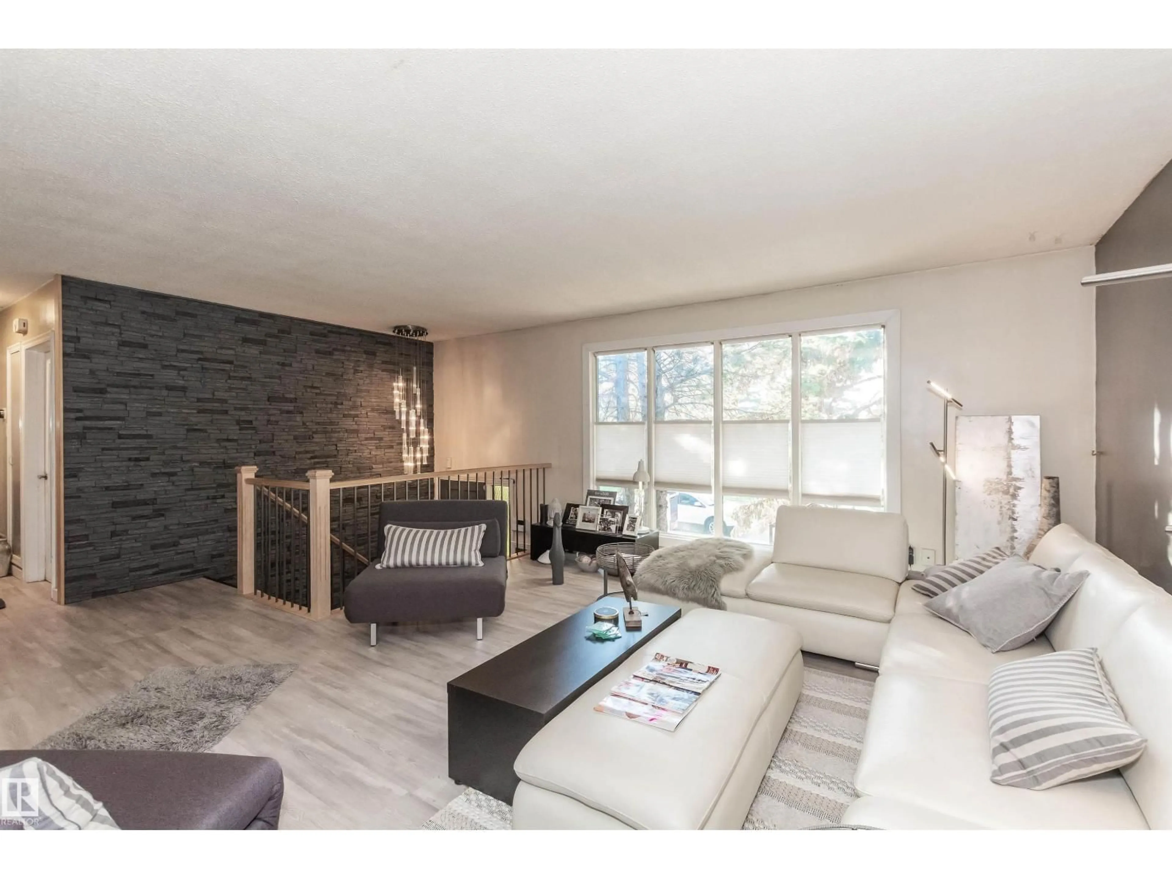 Living room with furniture, wood/laminate floor for NW - 13208 128 AV, Edmonton Alberta T5L3H2