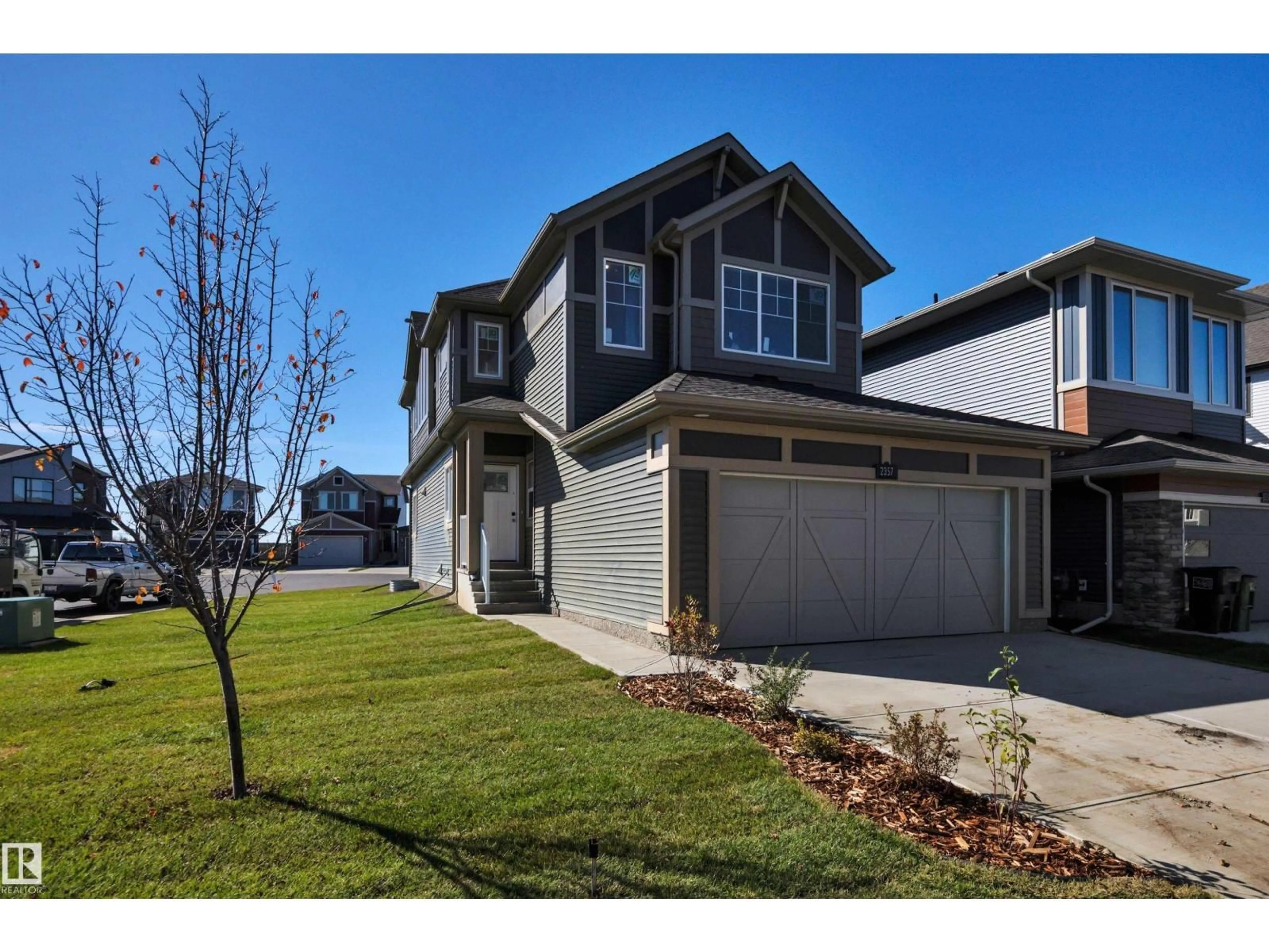 Home with vinyl exterior material, street for 2357 MUCKLEPLUM WY, Edmonton Alberta T6X3J9