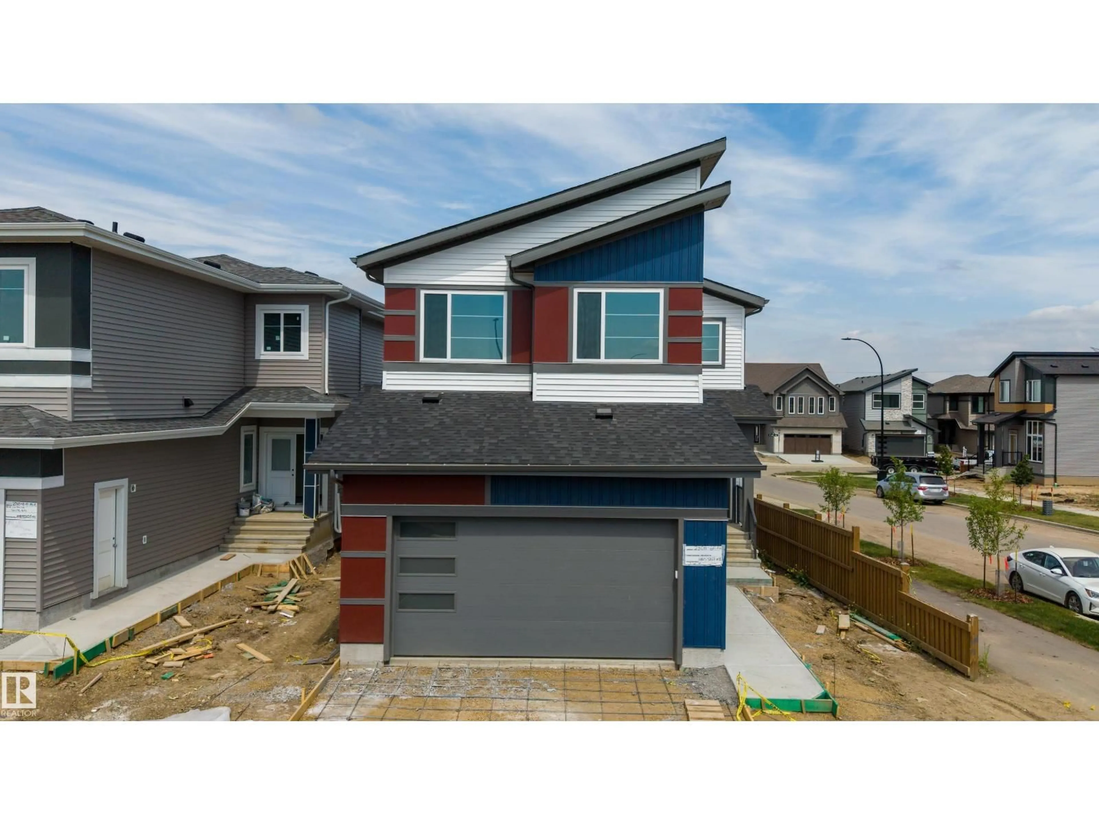 Home with vinyl exterior material, street for SW - 2306 6A AV, Edmonton Alberta T6X3M2