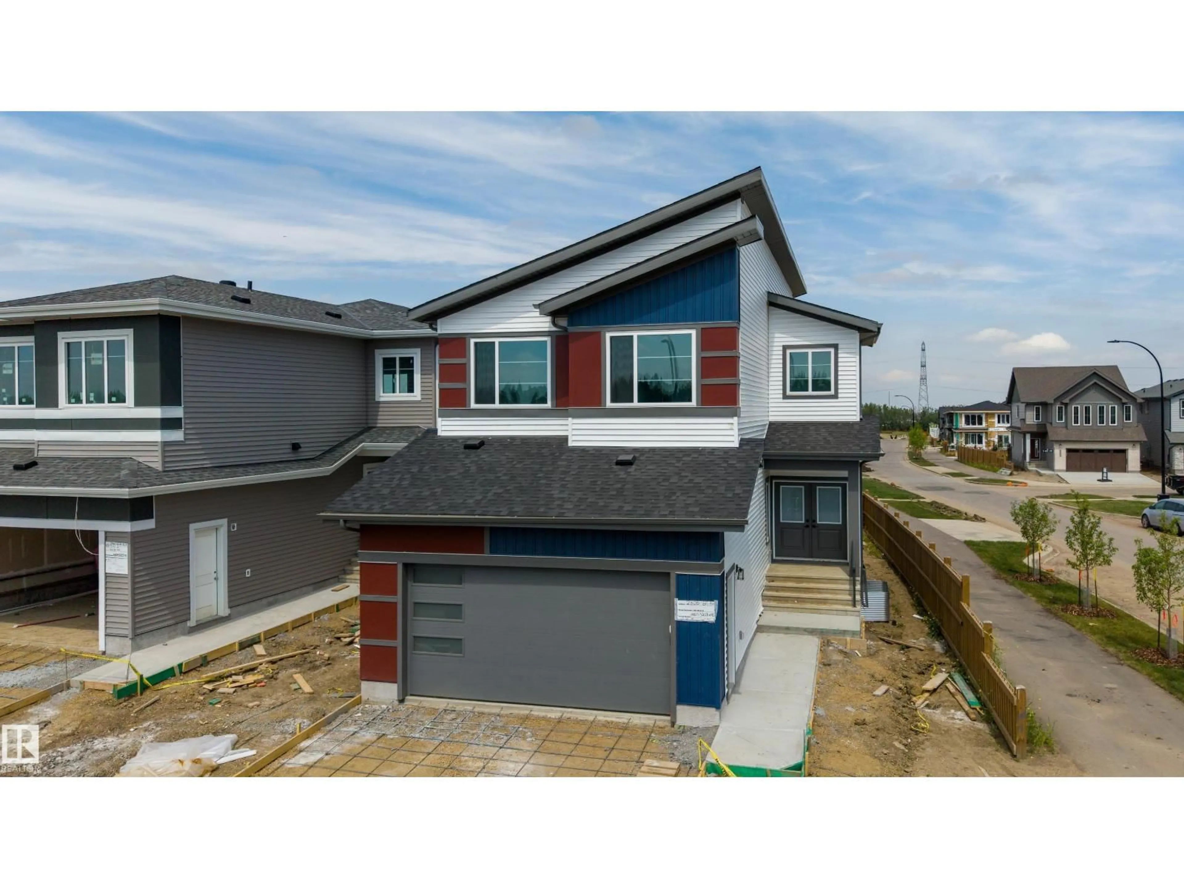 Home with vinyl exterior material, street for SW - 2306 6A AV, Edmonton Alberta T6X3M2