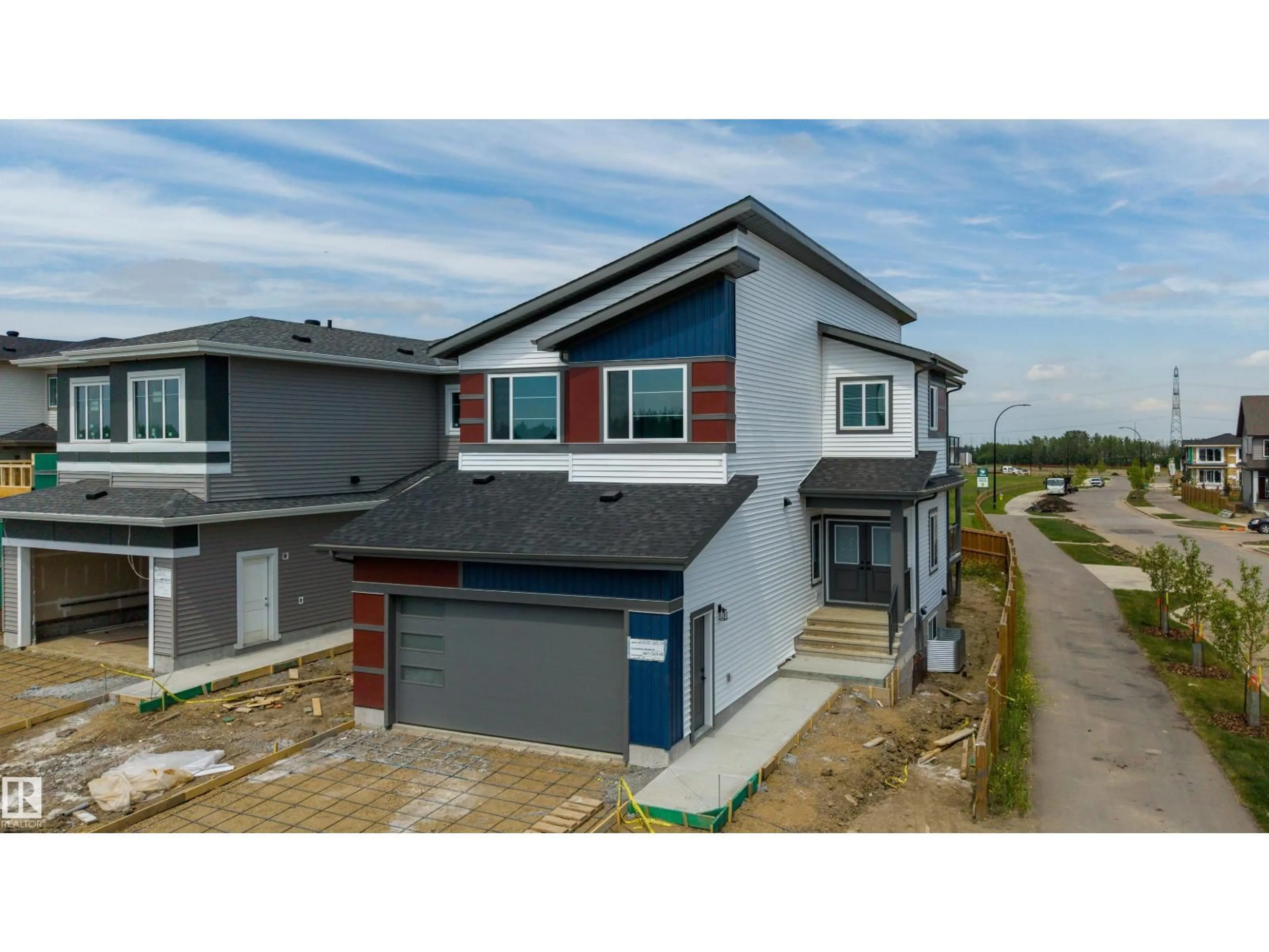 Home with vinyl exterior material, street for SW - 2306 6A AV, Edmonton Alberta T6X3M2