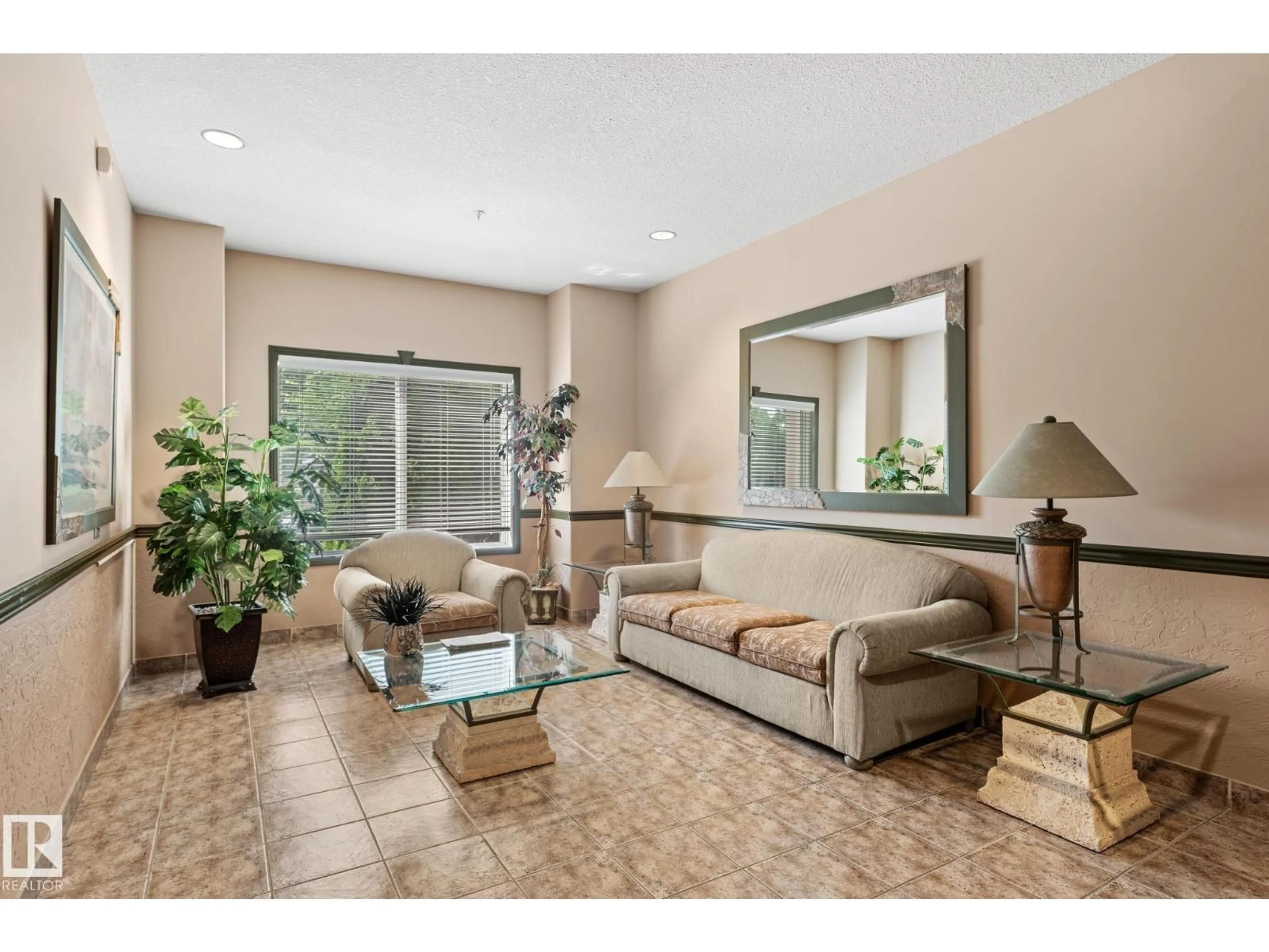 Living room with furniture, ceramic/tile floor for 306 - 6623 172 ST, Edmonton Alberta T5T4J5