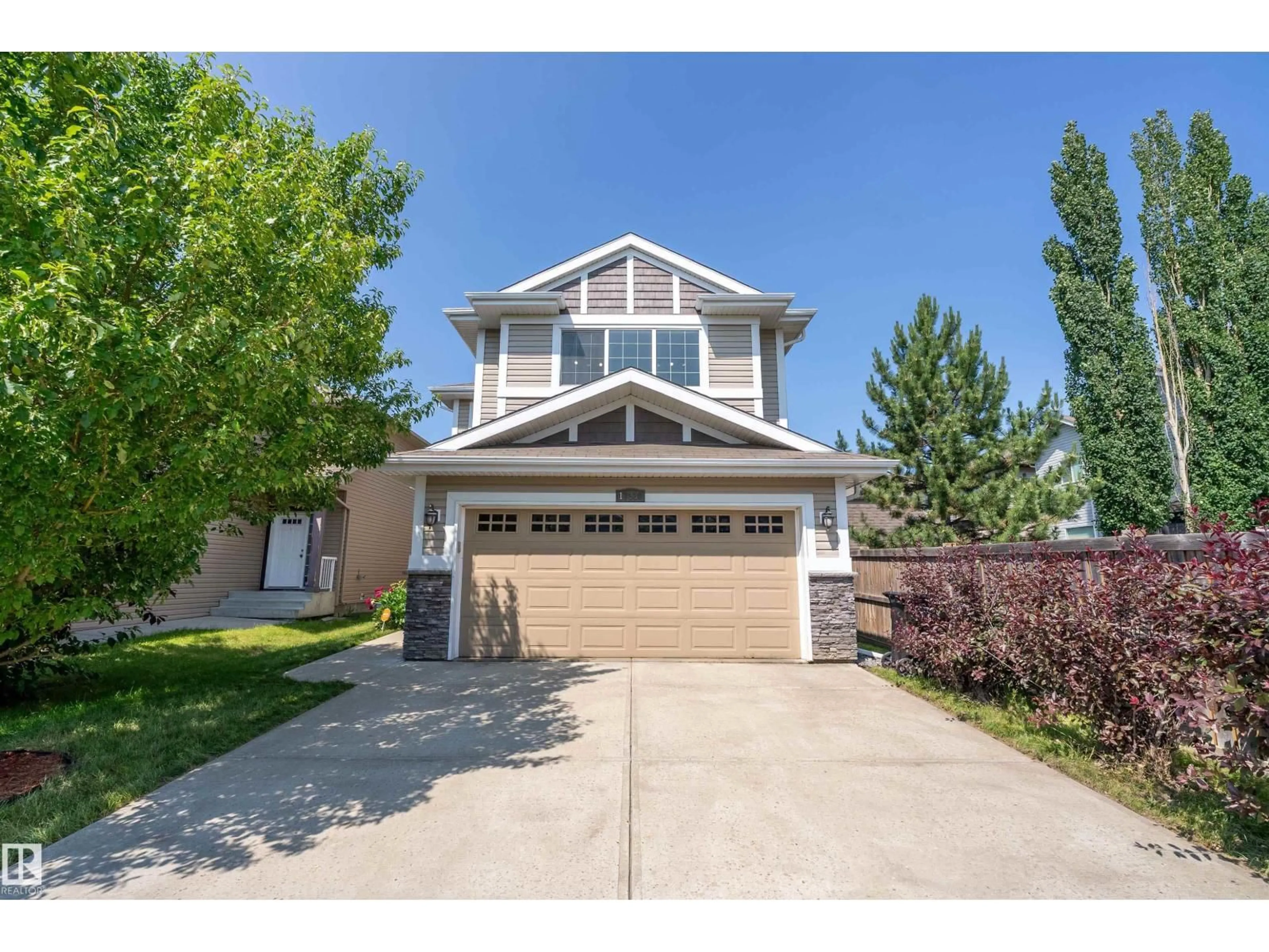 Home with vinyl exterior material, street for 17330 8A AV SW, Edmonton Alberta T6W0M8